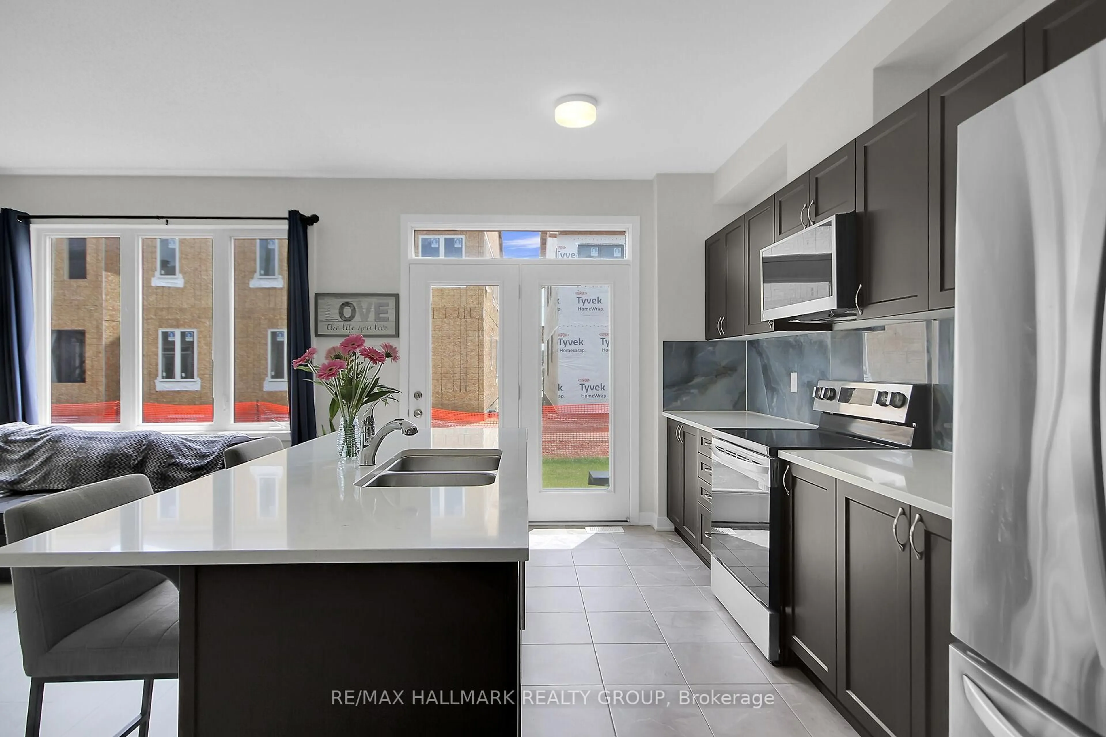 Open concept kitchen, ceramic/tile floor for 676 Quilter Row, Richmond Ontario K0A 2Z0
