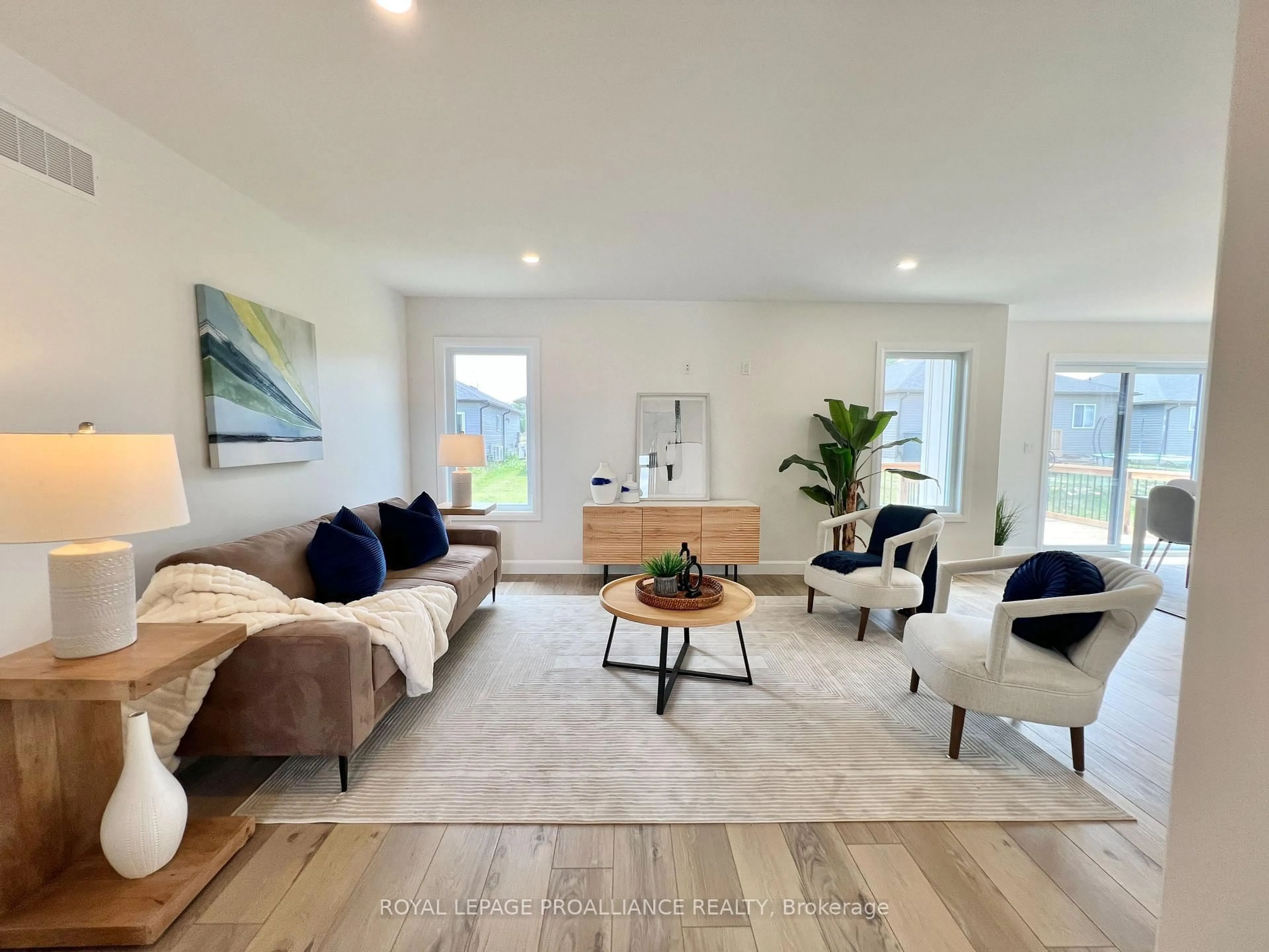 Living room with furniture, wood/laminate floor for 16 Horton Crt, Belleville Ontario K8P 0H3