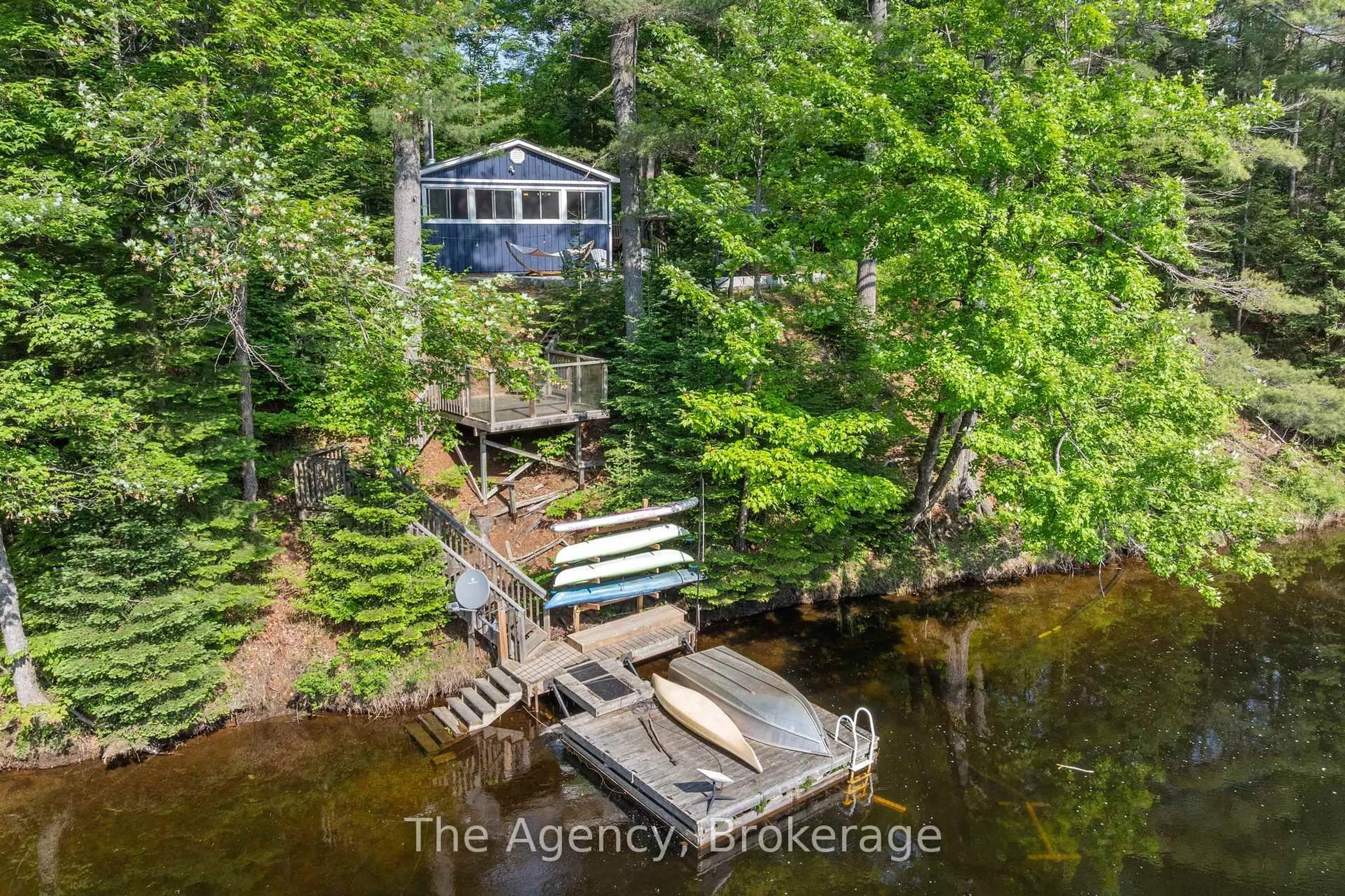 A pic from outside/outdoor area/front of a property/back of a property/a pic from drone, water/lake/river/ocean view for 1333 Sherwood Forest Rd, Bracebridge Ontario P1L 1X3