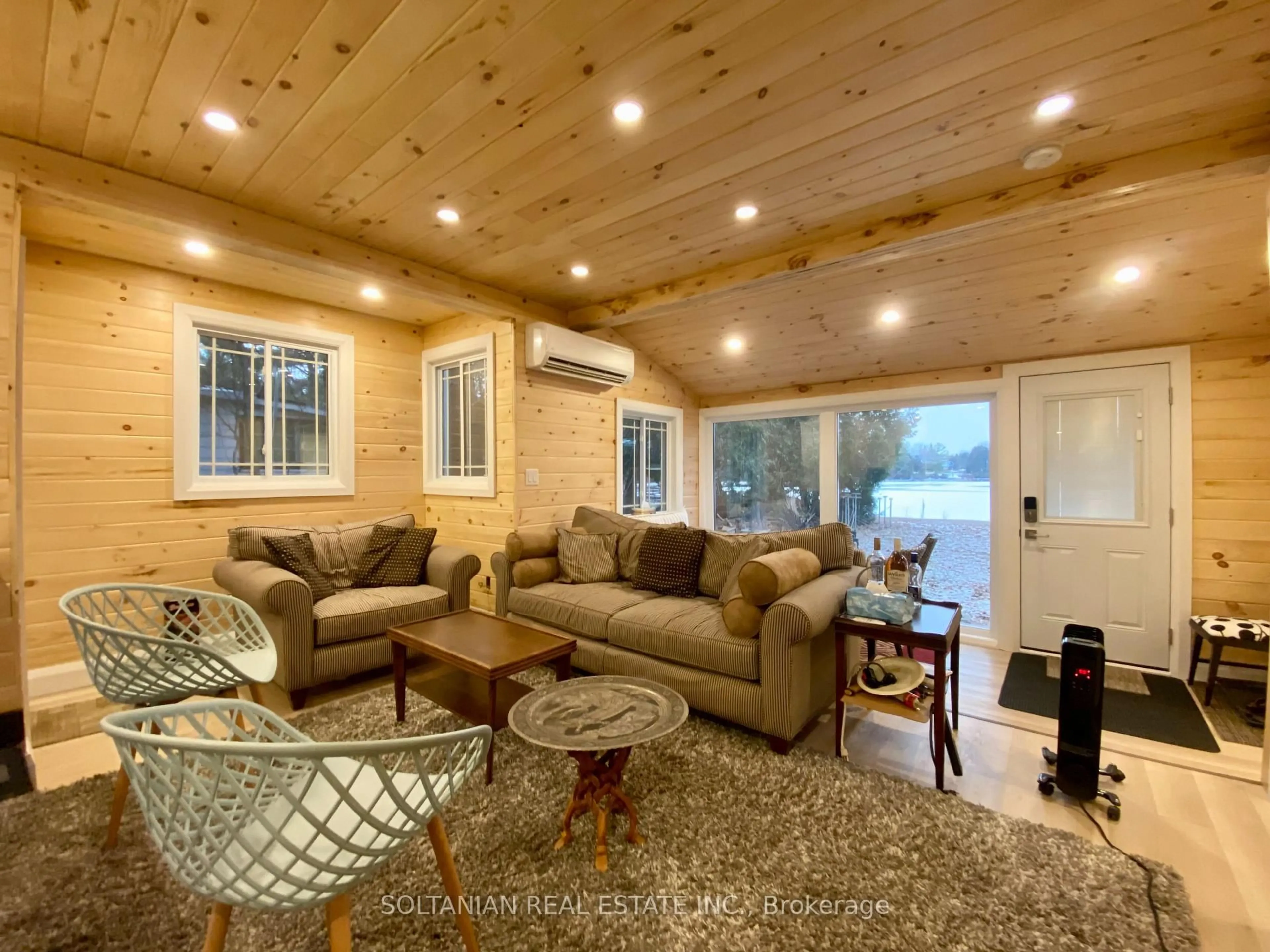 Living room with furniture, wood/laminate floor for 29 Paradise Rd, Kawartha Lakes Ontario K0M 1B0