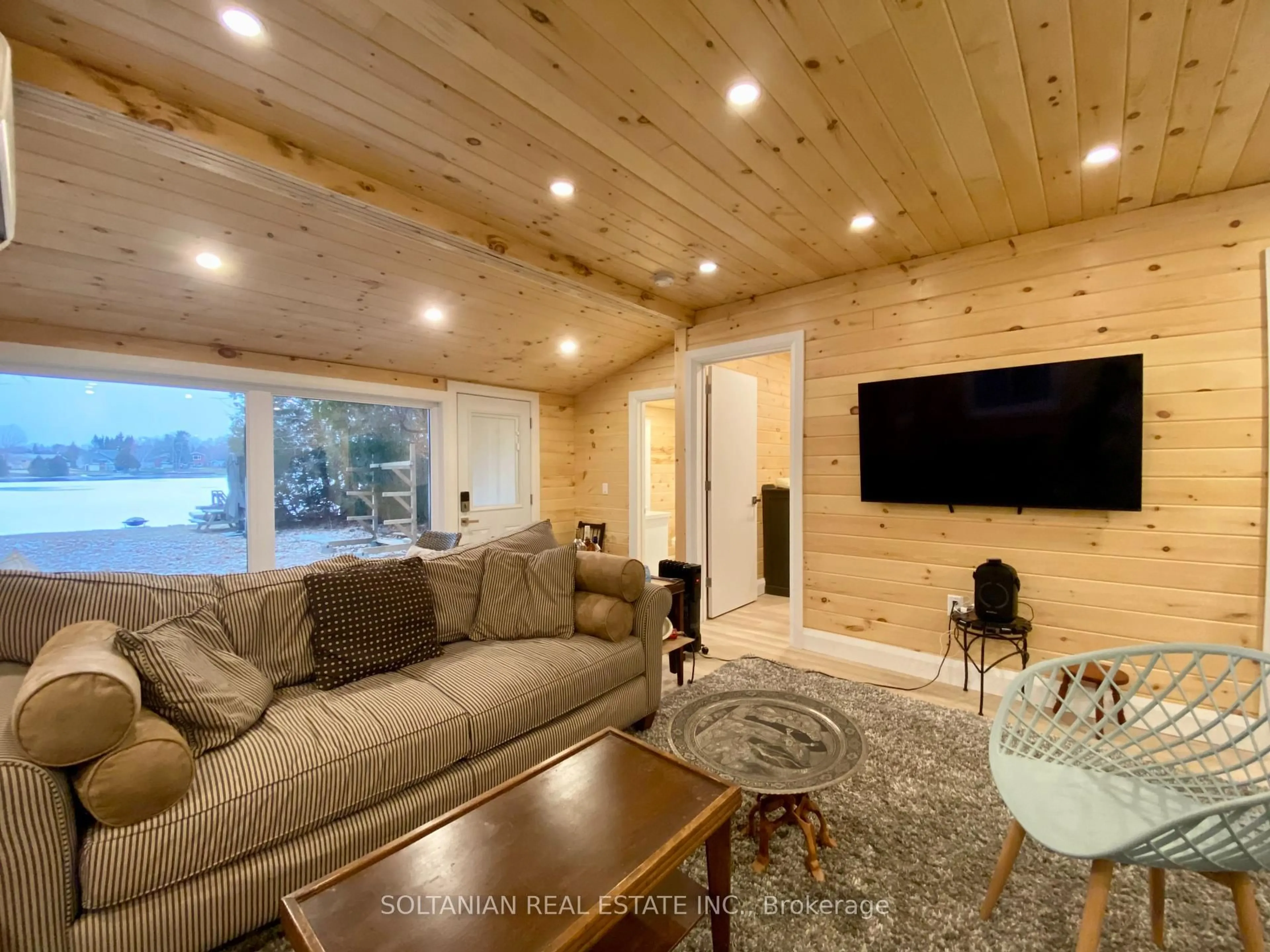 Living room with furniture, wood/laminate floor for 29 Paradise Rd, Kawartha Lakes Ontario K0M 1B0