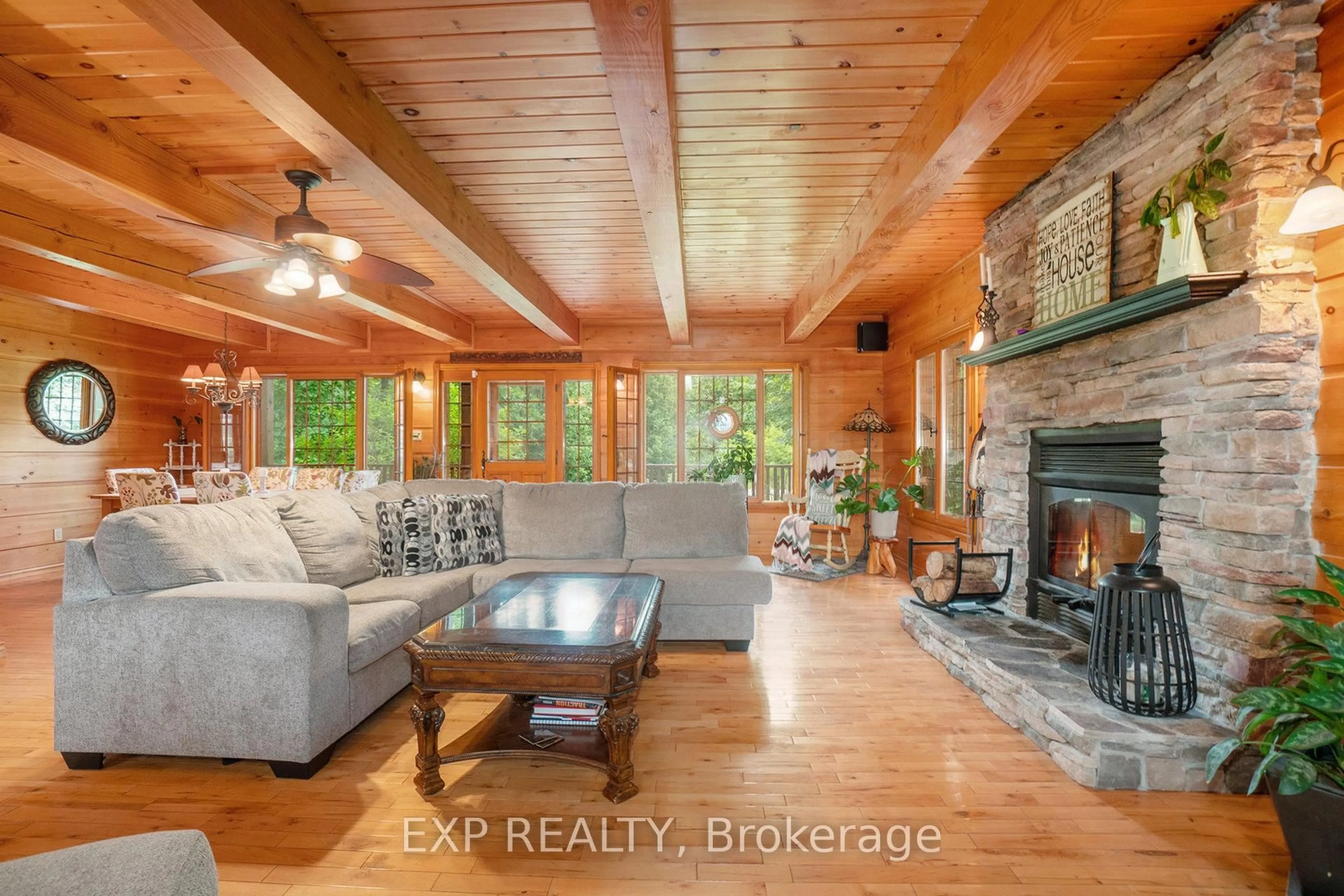 Living room with furniture, wood/laminate floor for 7925 Resolute Way, Metcalfe Ontario K0A 2P0