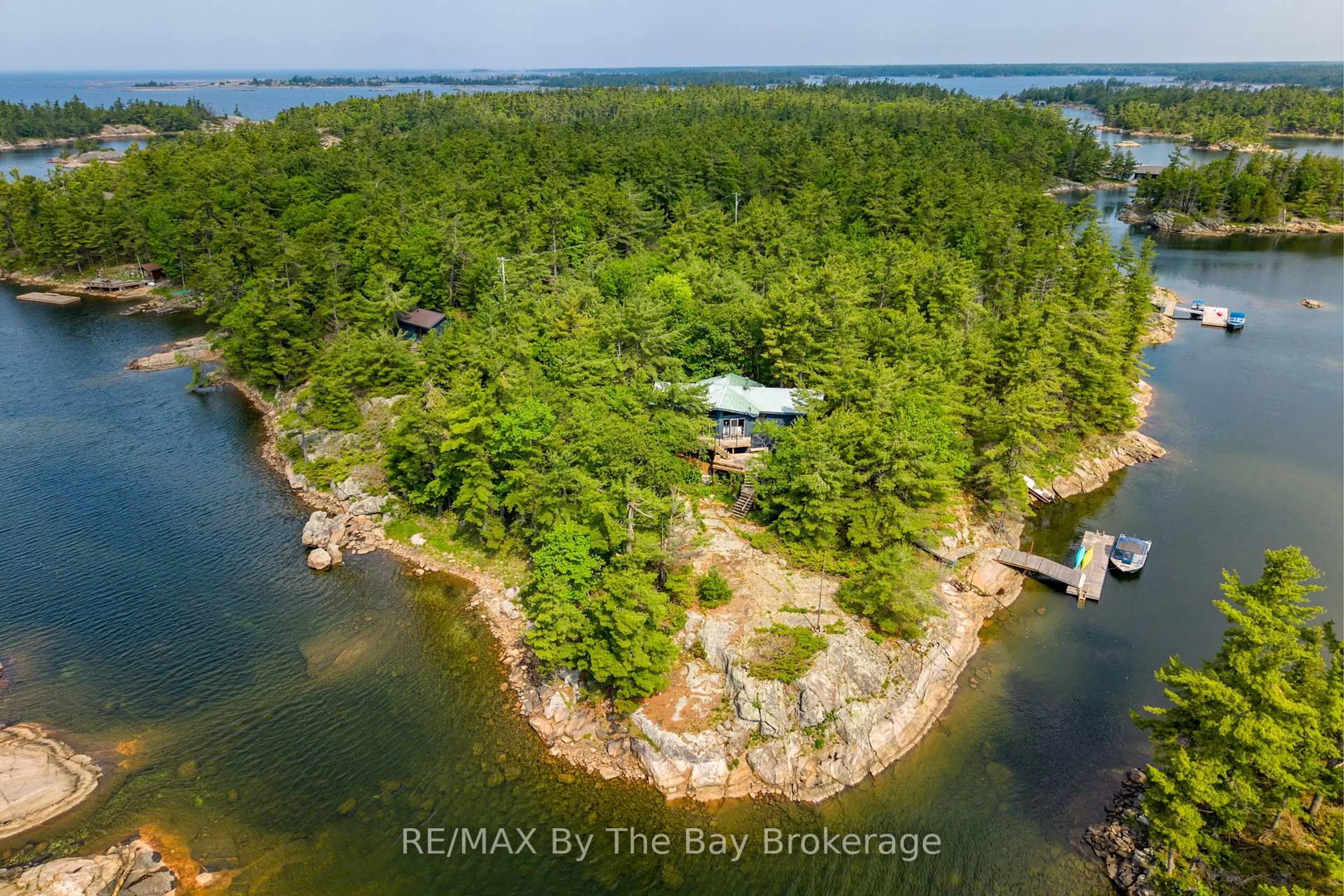 A pic from outside/outdoor area/front of a property/back of a property/a pic from drone, water/lake/river/ocean view for 12 Is 3900 Georgian Bay, Georgian Bay Ontario L0K 1S0