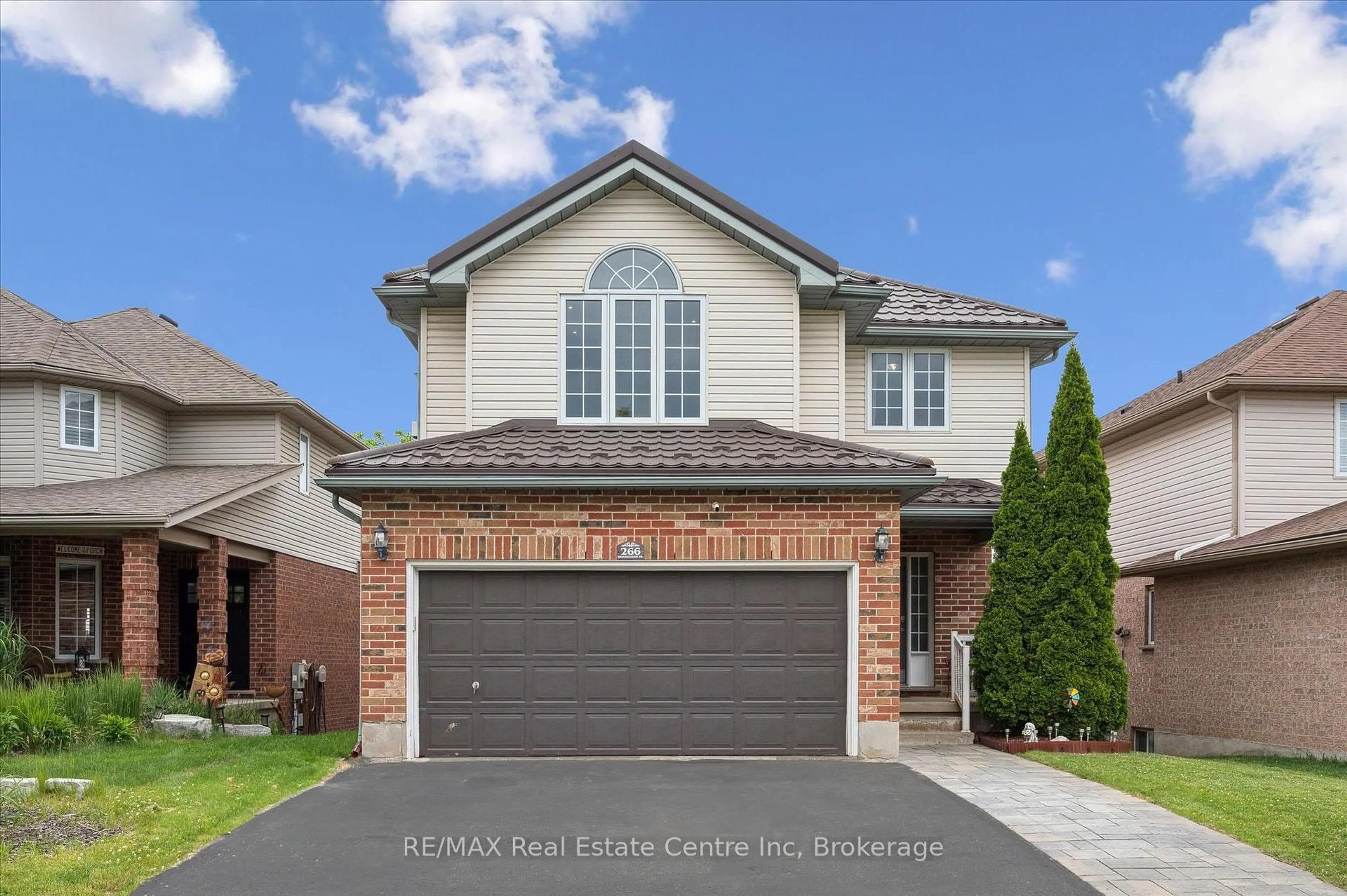 Home with brick exterior material, street for 266 Briarmeadow Dr, Kitchener Ontario N2A 4H5