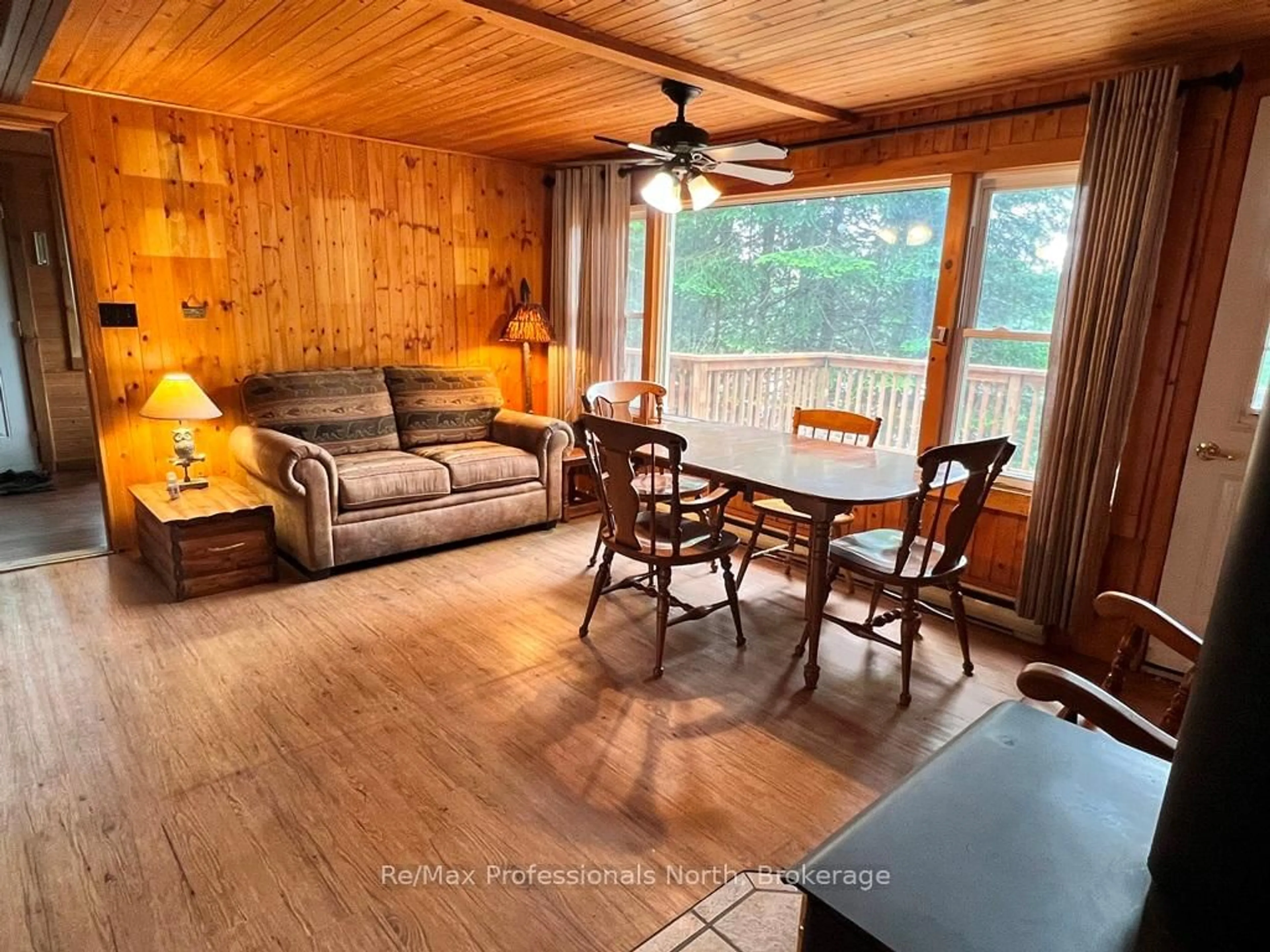 Living room with furniture, wood/laminate floor for 1396 Betula Cres, Dysart et al Ontario K0L 1M1