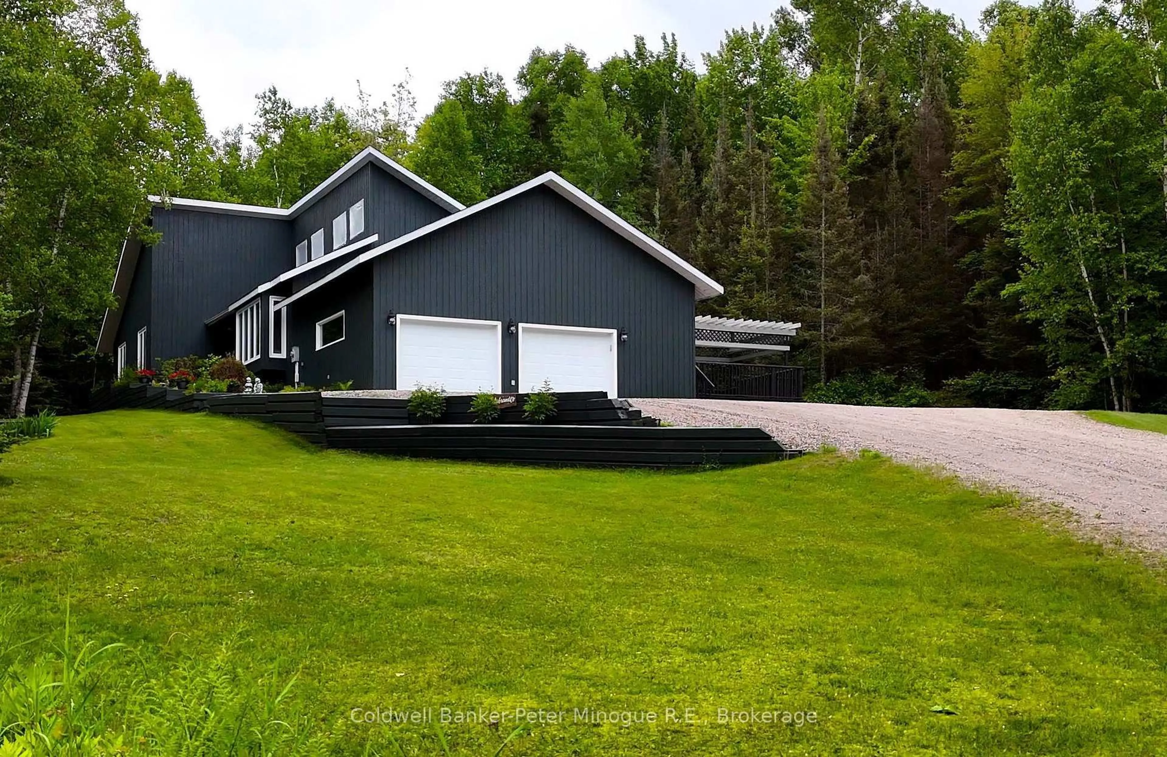 A pic from outside/outdoor area/front of a property/back of a property/a pic from drone, street for 1224 Village Rd, East Ferris Ontario P0H 1B0