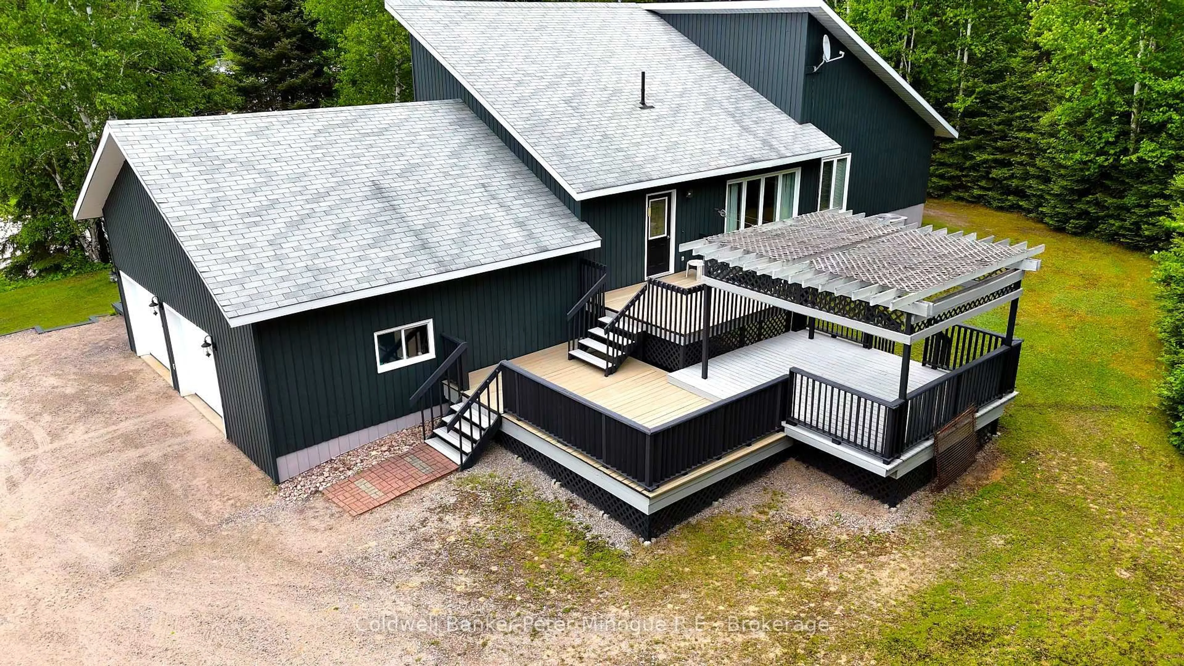 A pic from outside/outdoor area/front of a property/back of a property/a pic from drone, building for 1224 Village Rd, East Ferris Ontario P0H 1B0