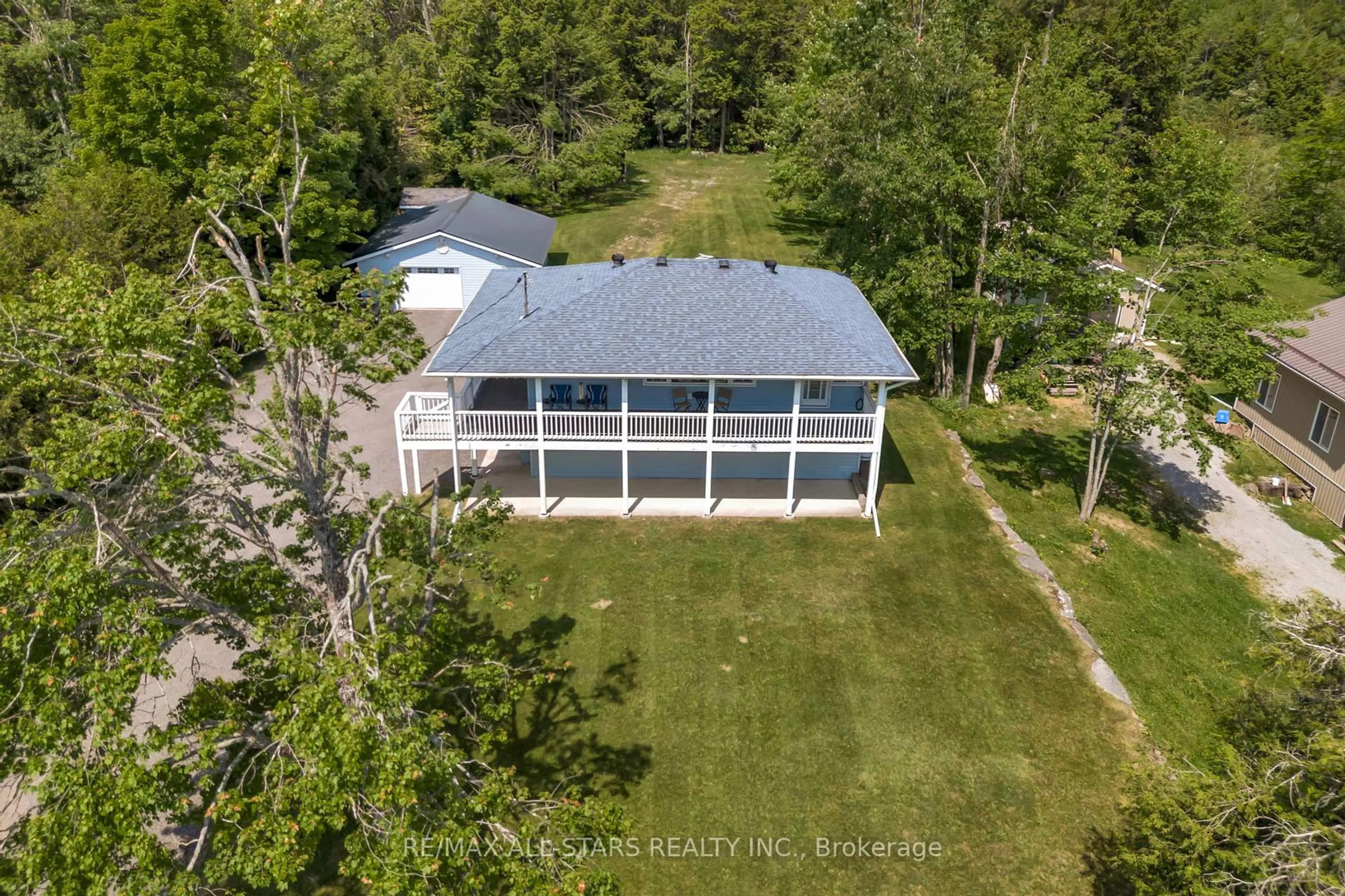 A pic from outside/outdoor area/front of a property/back of a property/a pic from drone, water/lake/river/ocean view for 394 Kennedy Dr, Trent Lakes Ontario K0M 1A0