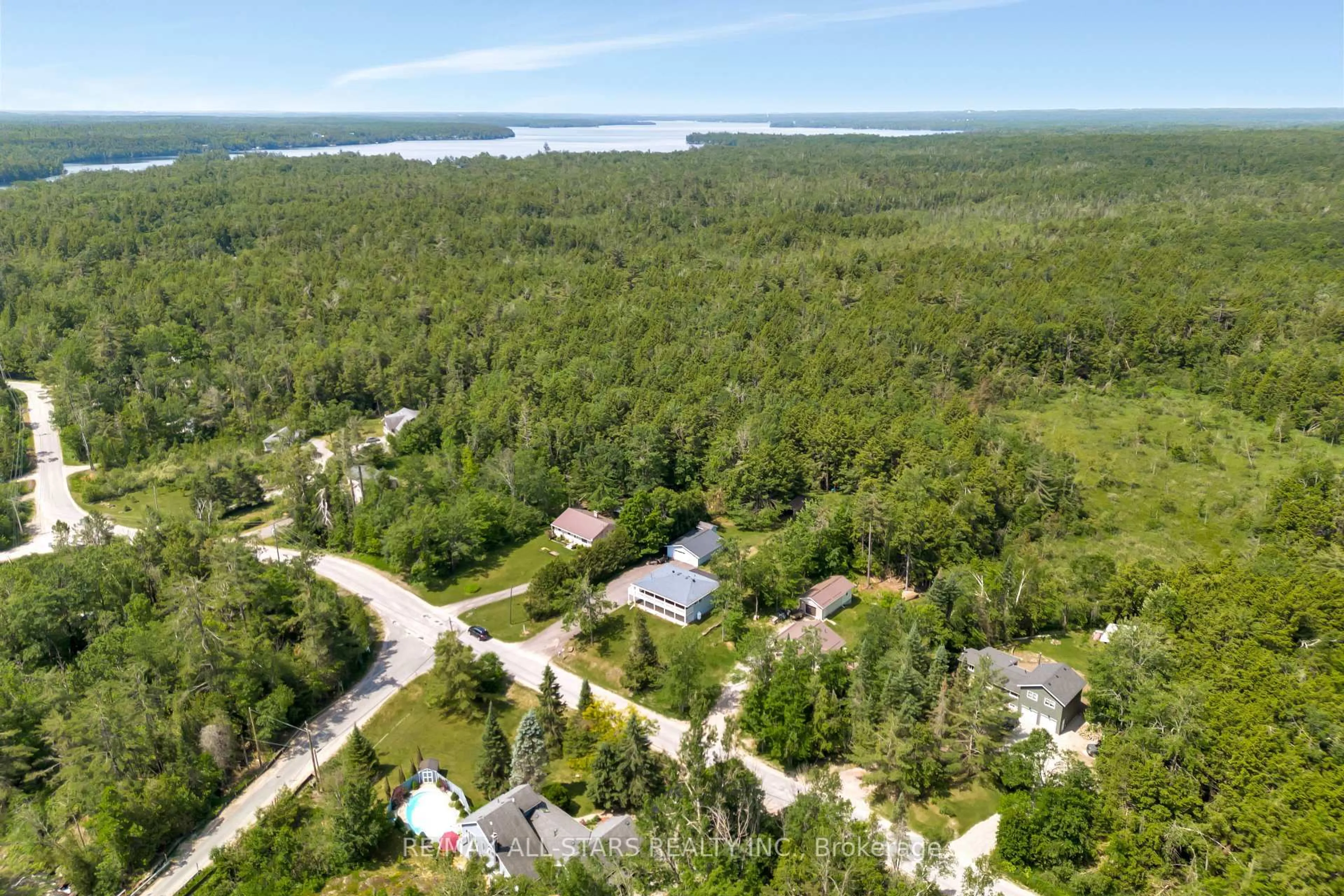 A pic from outside/outdoor area/front of a property/back of a property/a pic from drone, water/lake/river/ocean view for 394 Kennedy Dr, Trent Lakes Ontario K0M 1A0