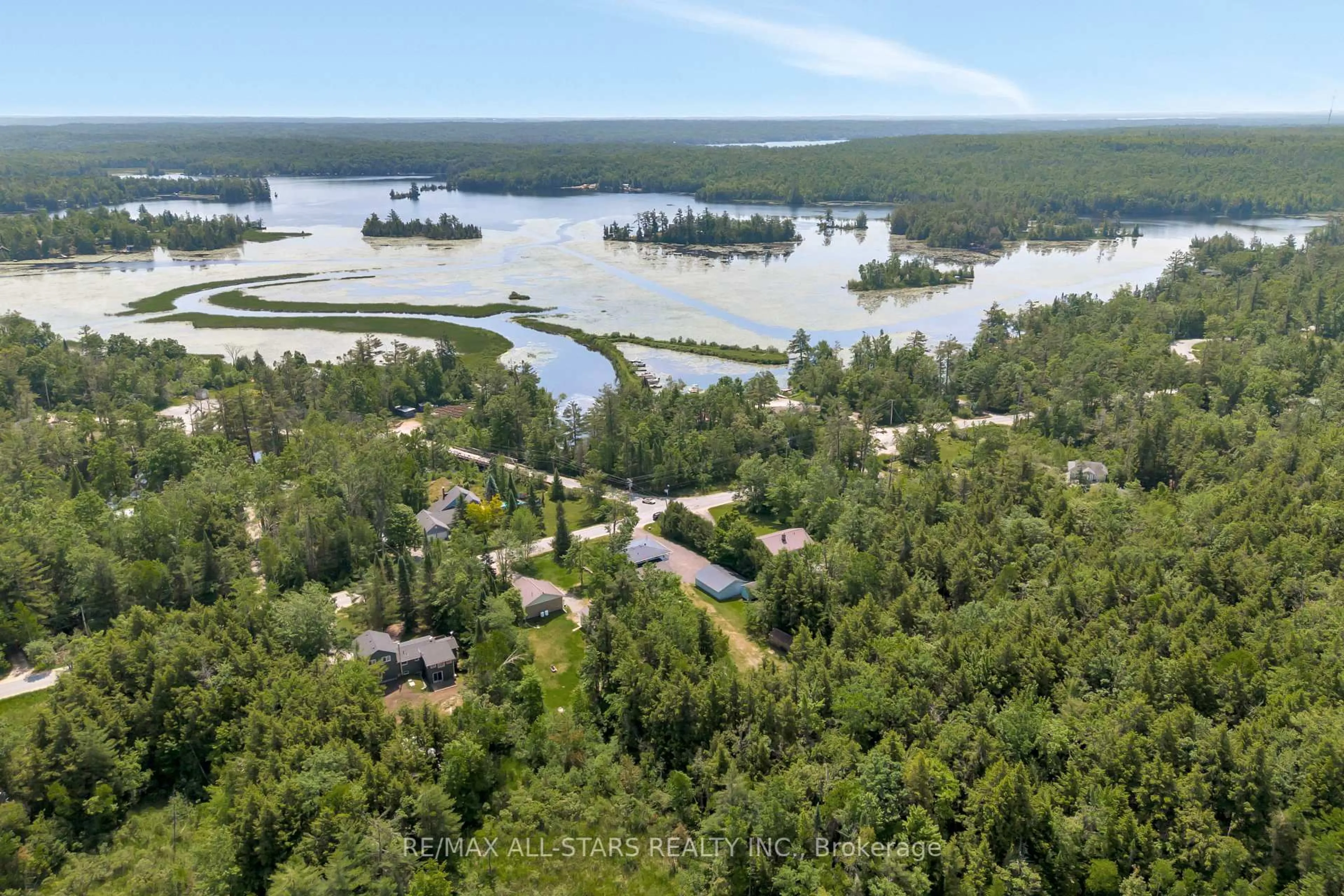 A pic from outside/outdoor area/front of a property/back of a property/a pic from drone, water/lake/river/ocean view for 394 Kennedy Dr, Trent Lakes Ontario K0M 1A0