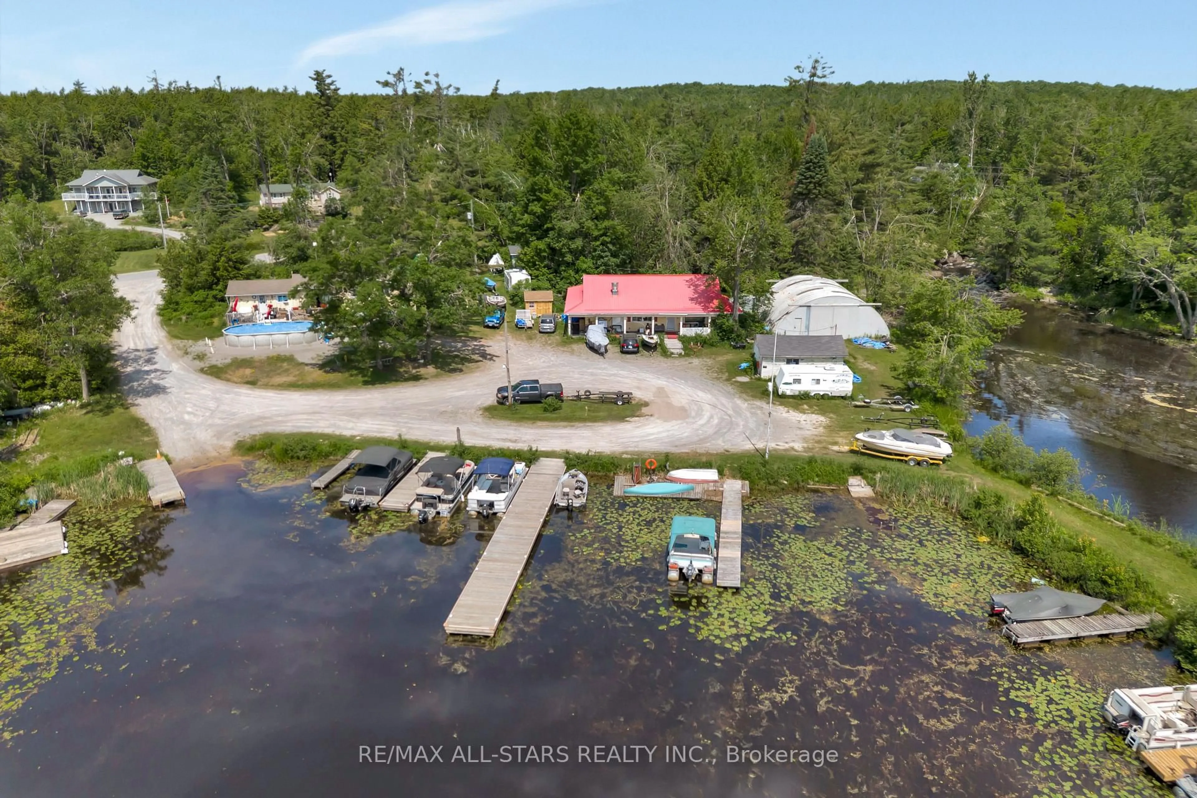 A pic from outside/outdoor area/front of a property/back of a property/a pic from drone, water/lake/river/ocean view for 394 Kennedy Dr, Trent Lakes Ontario K0M 1A0