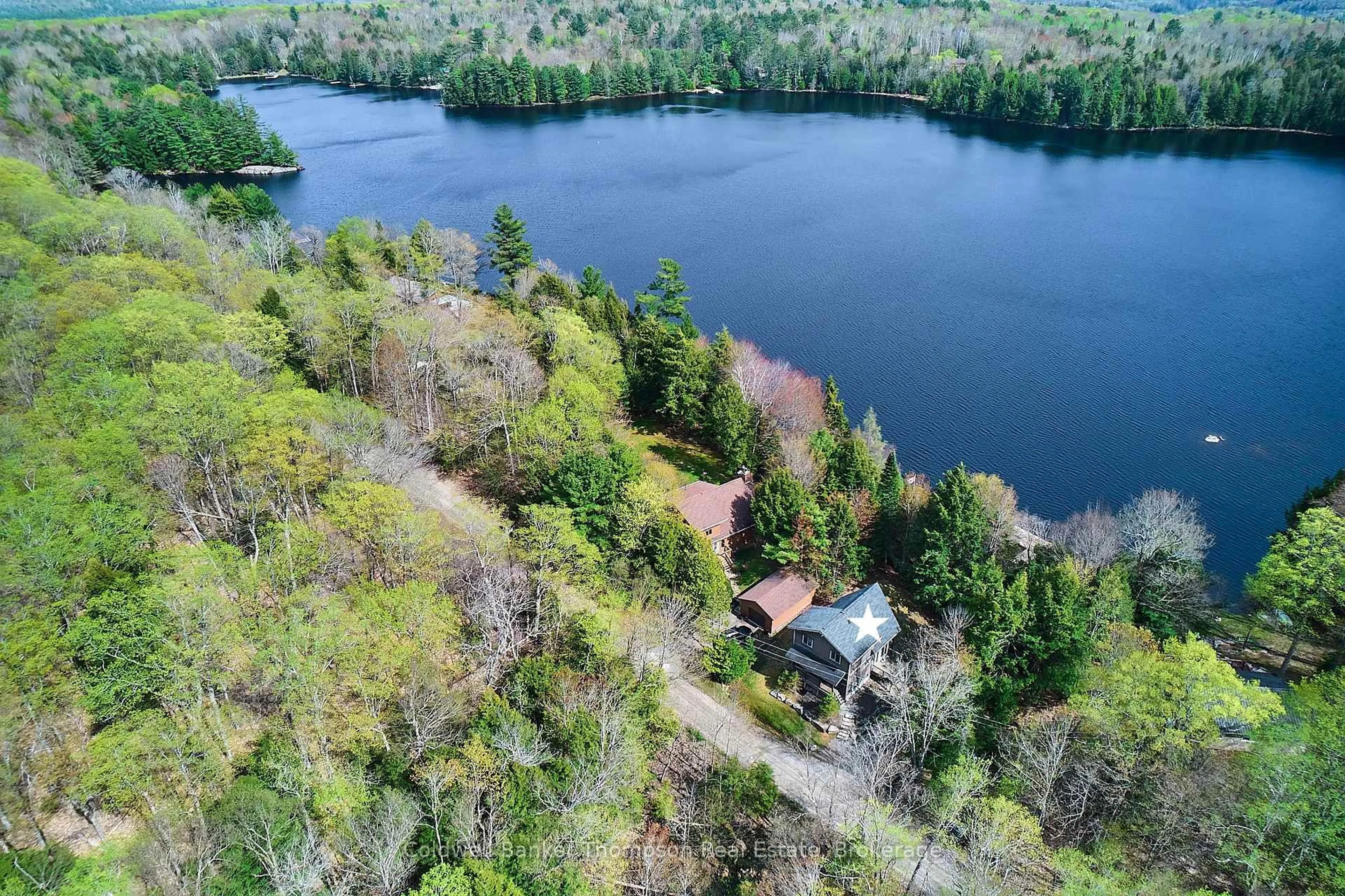 A pic from outside/outdoor area/front of a property/back of a property/a pic from drone, water/lake/river/ocean view for 299 Pine Ridge Rd, Huntsville Ontario P1H 1J3