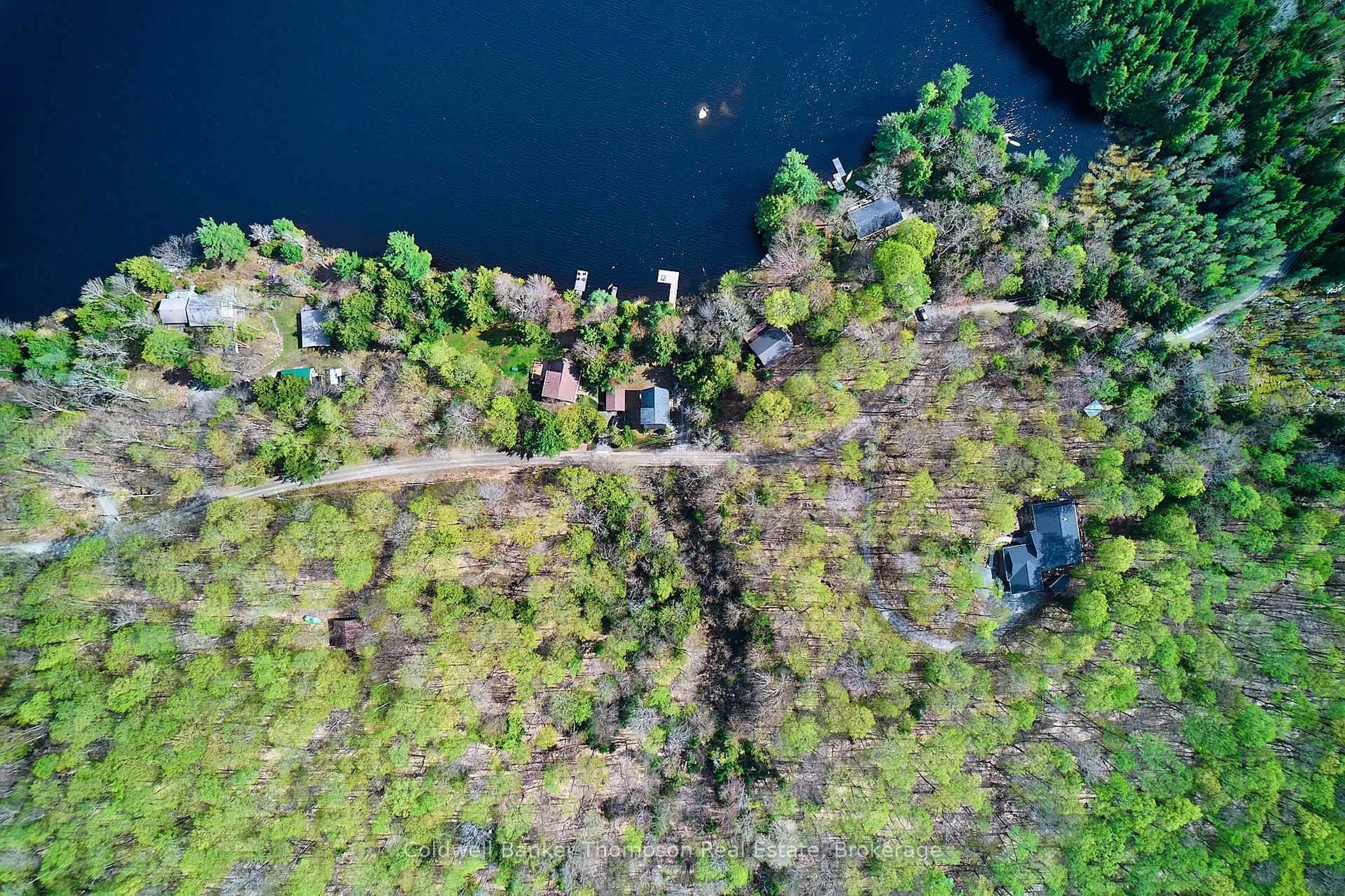 A pic from outside/outdoor area/front of a property/back of a property/a pic from drone, water/lake/river/ocean view for 299 Pine Ridge Rd, Huntsville Ontario P1H 1J3