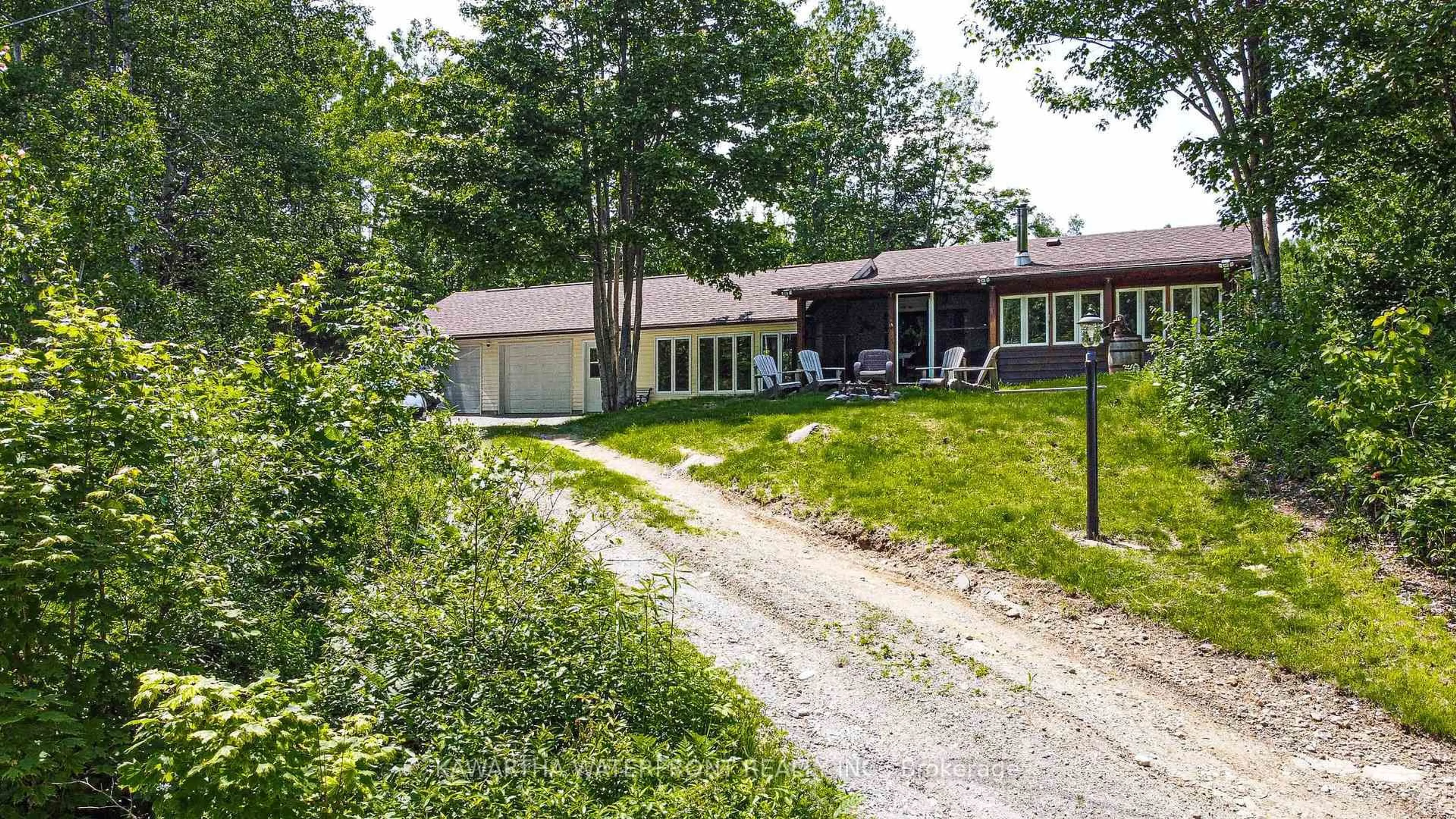 A pic from outside/outdoor area/front of a property/back of a property/a pic from drone, street for 1170 English Circ, Highlands East Ontario K0M 1R0