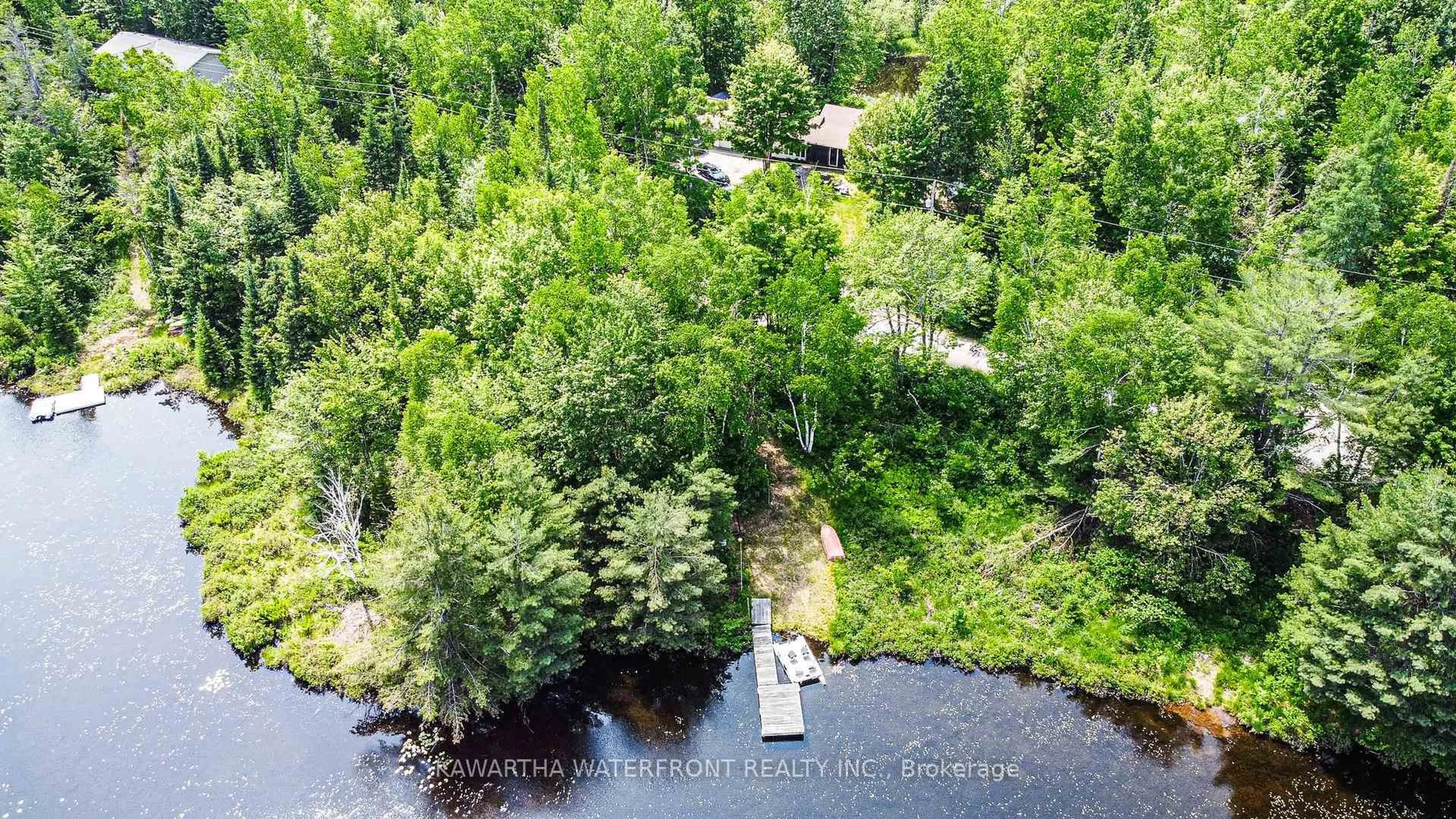 A pic from outside/outdoor area/front of a property/back of a property/a pic from drone, water/lake/river/ocean view for 1170 English Circ, Highlands East Ontario K0M 1R0