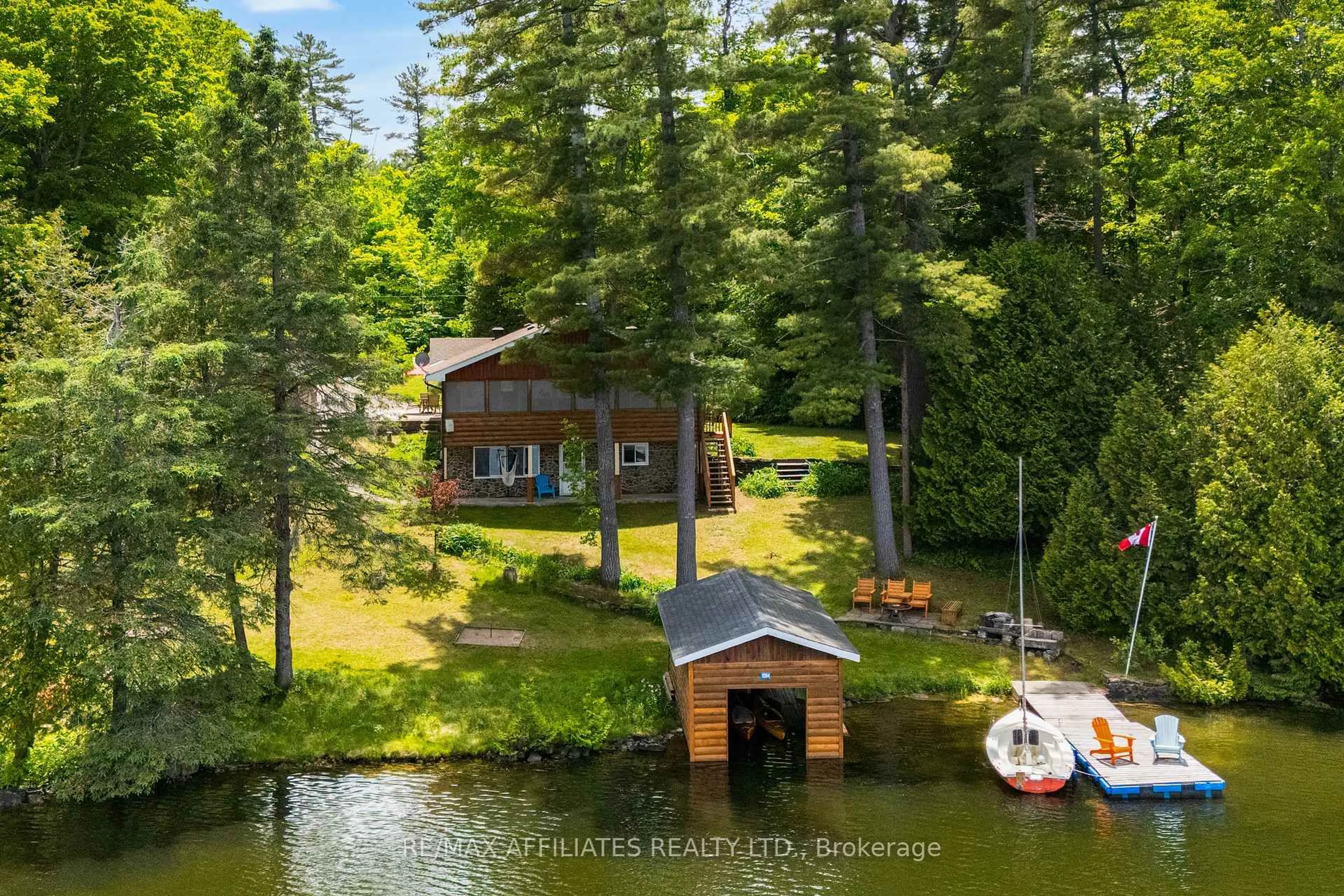 A pic from outside/outdoor area/front of a property/back of a property/a pic from drone, water/lake/river/ocean view for 1094 Snye Rd, White Lake Ontario K0A 3L0