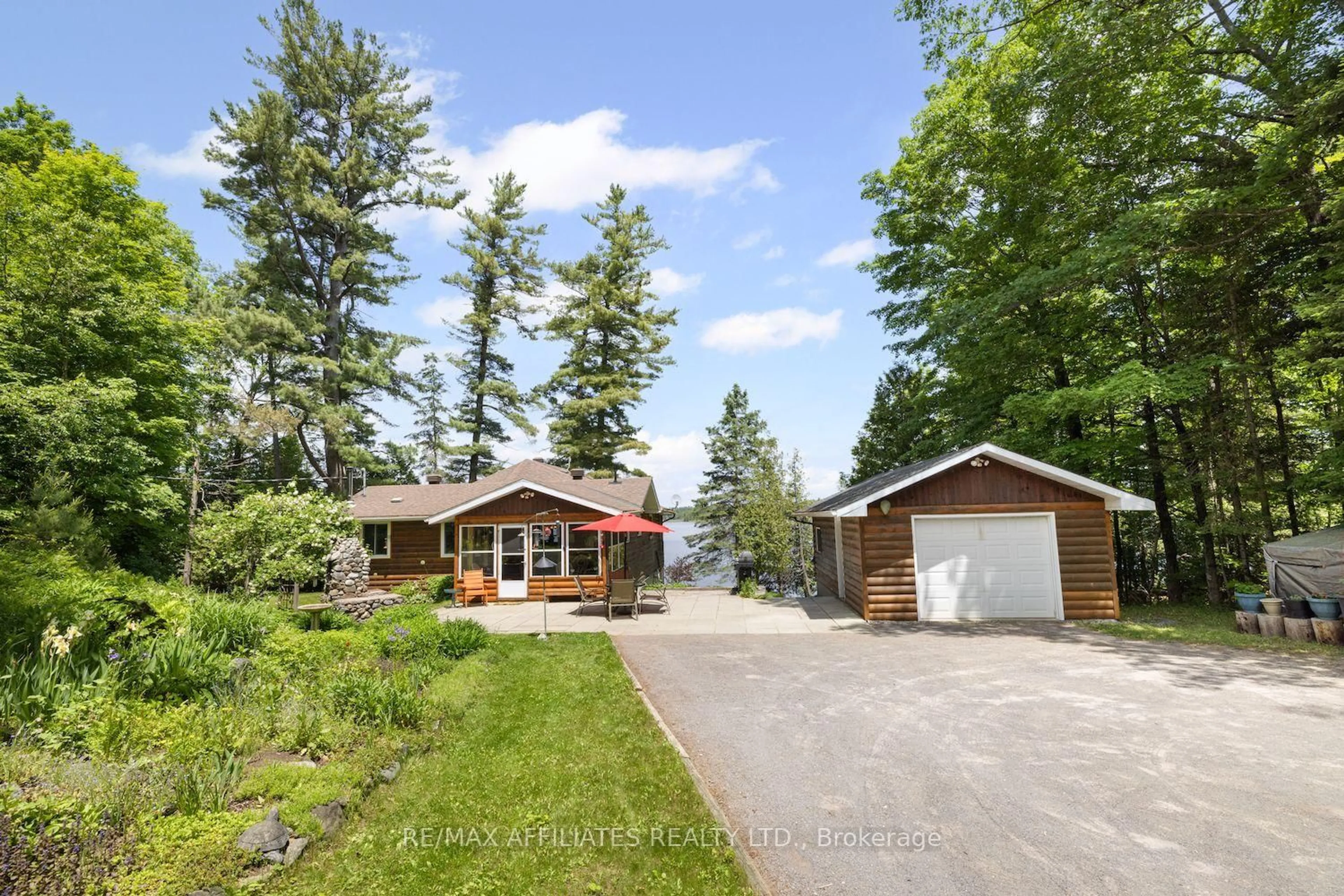 A pic from outside/outdoor area/front of a property/back of a property/a pic from drone, forest/trees view for 1094 Snye Rd, White Lake Ontario K0A 3L0