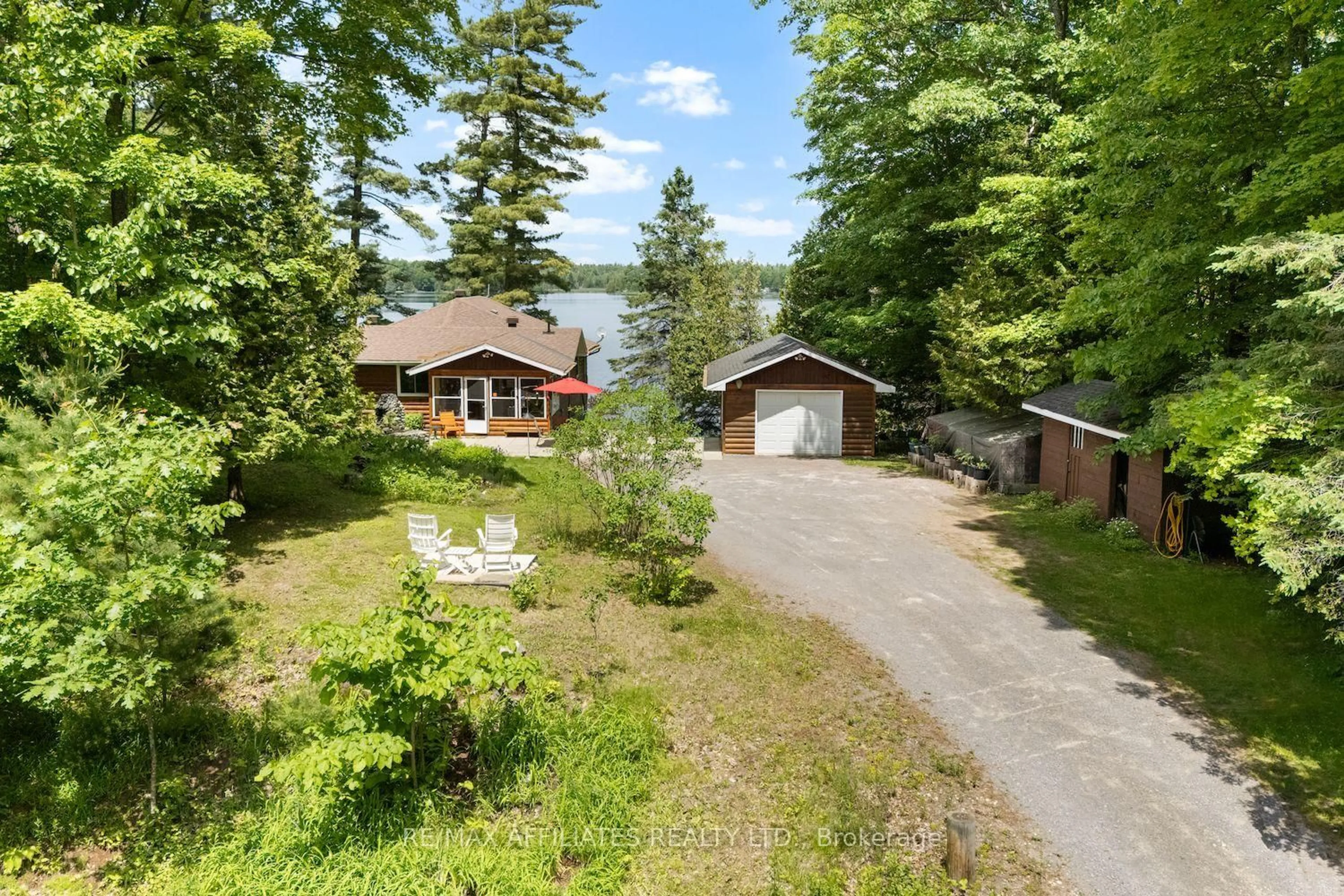 A pic from outside/outdoor area/front of a property/back of a property/a pic from drone, water/lake/river/ocean view for 1094 Snye Rd, White Lake Ontario K0A 3L0