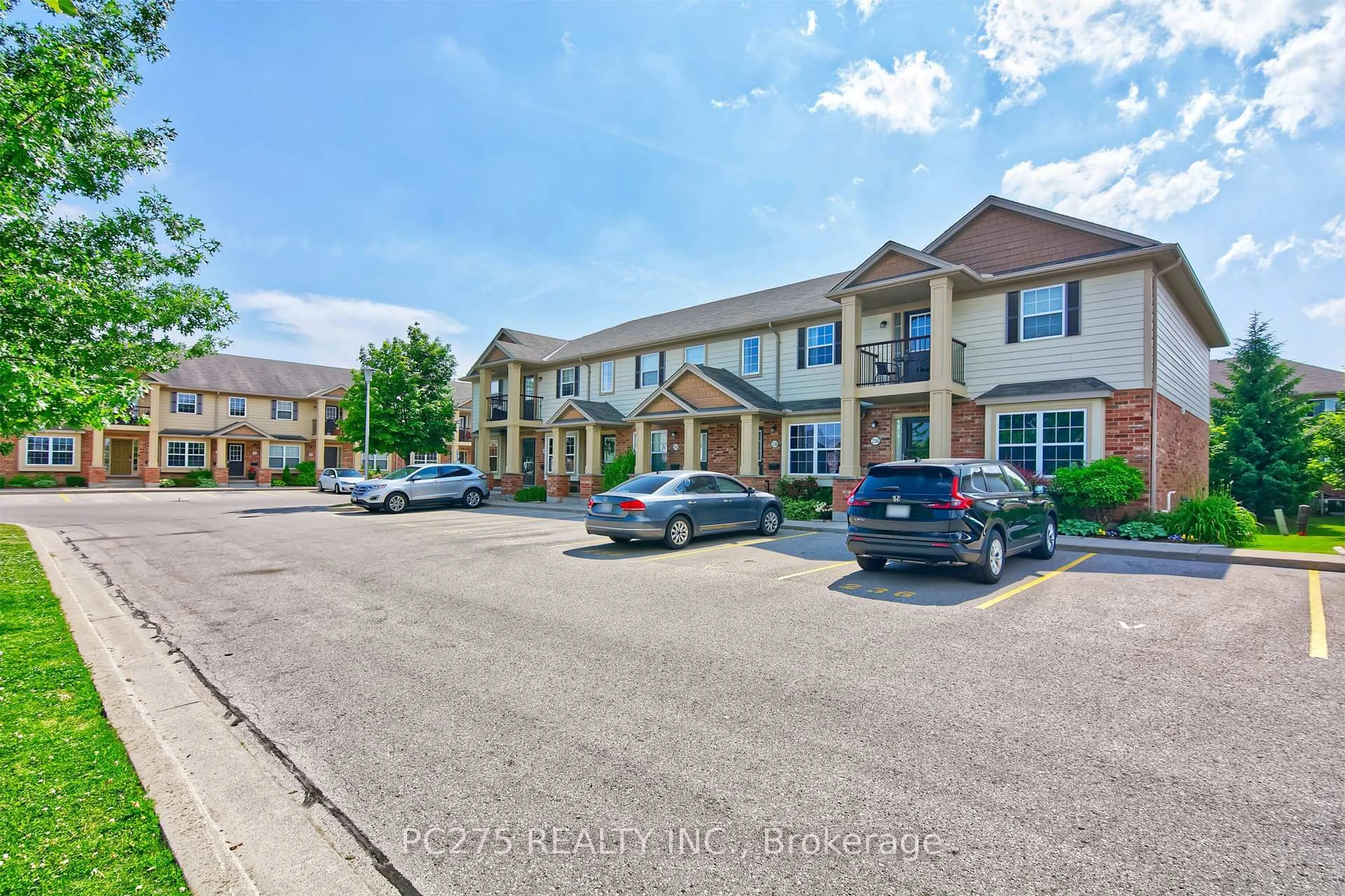 A pic from outside/outdoor area/front of a property/back of a property/a pic from drone, street for 3320 Meadowgate Blvd #236, London South Ontario N6M 0A7