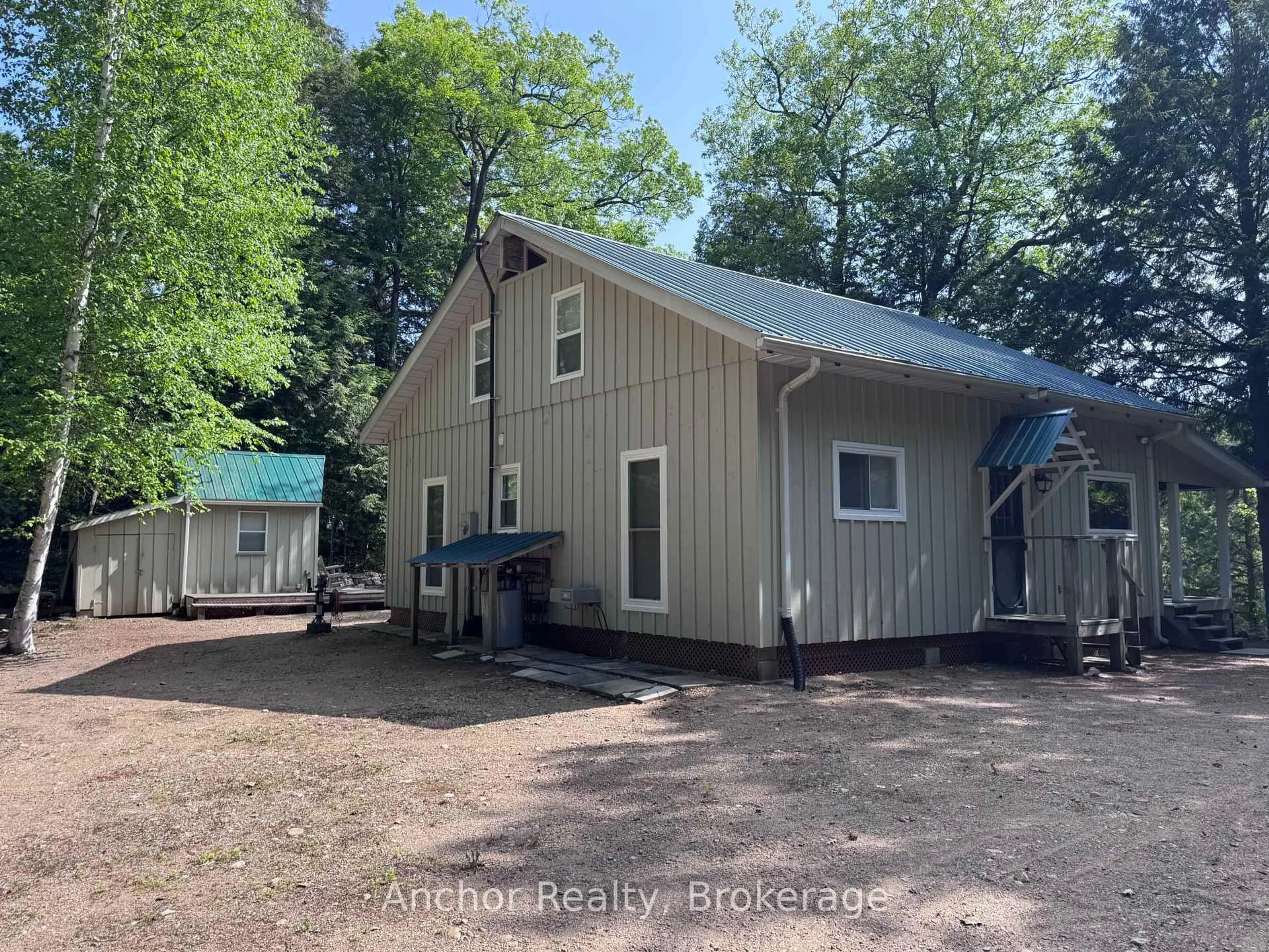 A pic from outside/outdoor area/front of a property/back of a property/a pic from drone, building for 10469 Little Hawk Lake, Algonquin Highlands Ontario K0M 1S0