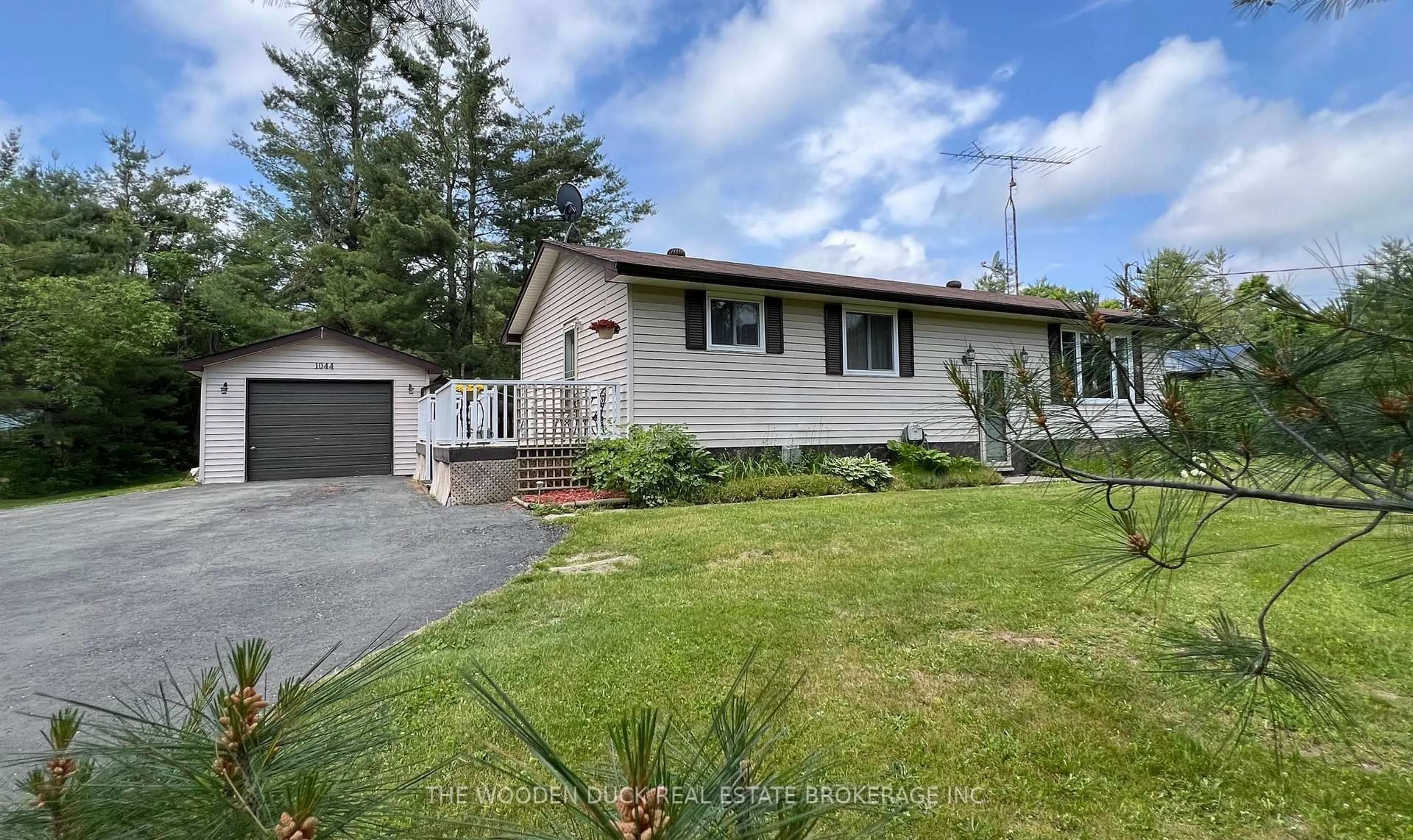 A pic from outside/outdoor area/front of a property/back of a property/a pic from drone, street for 1044 County 40 Rd, Douro-Dummer Ontario K0L 2V0