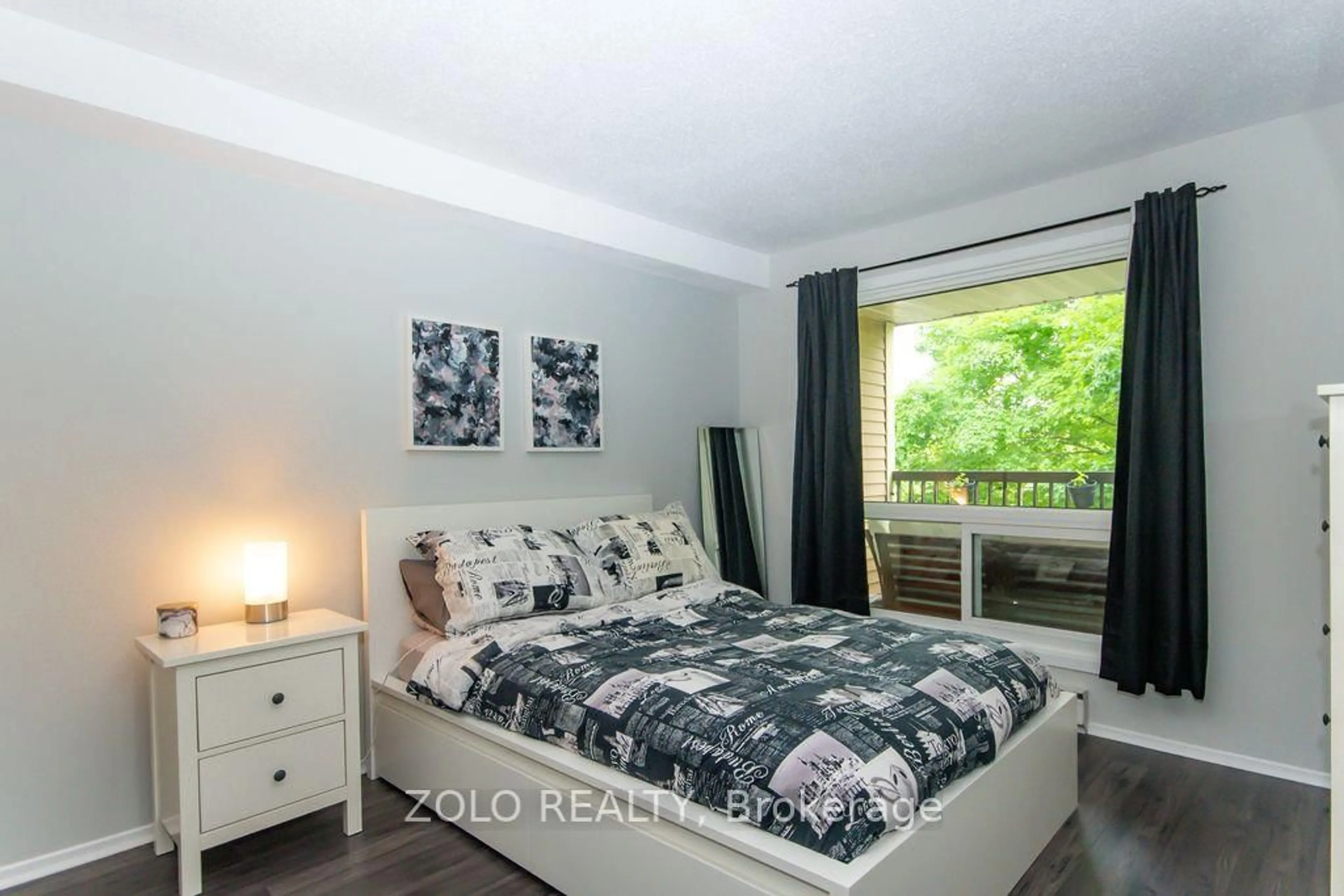 Bedroom with bed, wood/laminate floor for 6376 Bilberry Dr #206, Orleans Ontario K1C 4P8