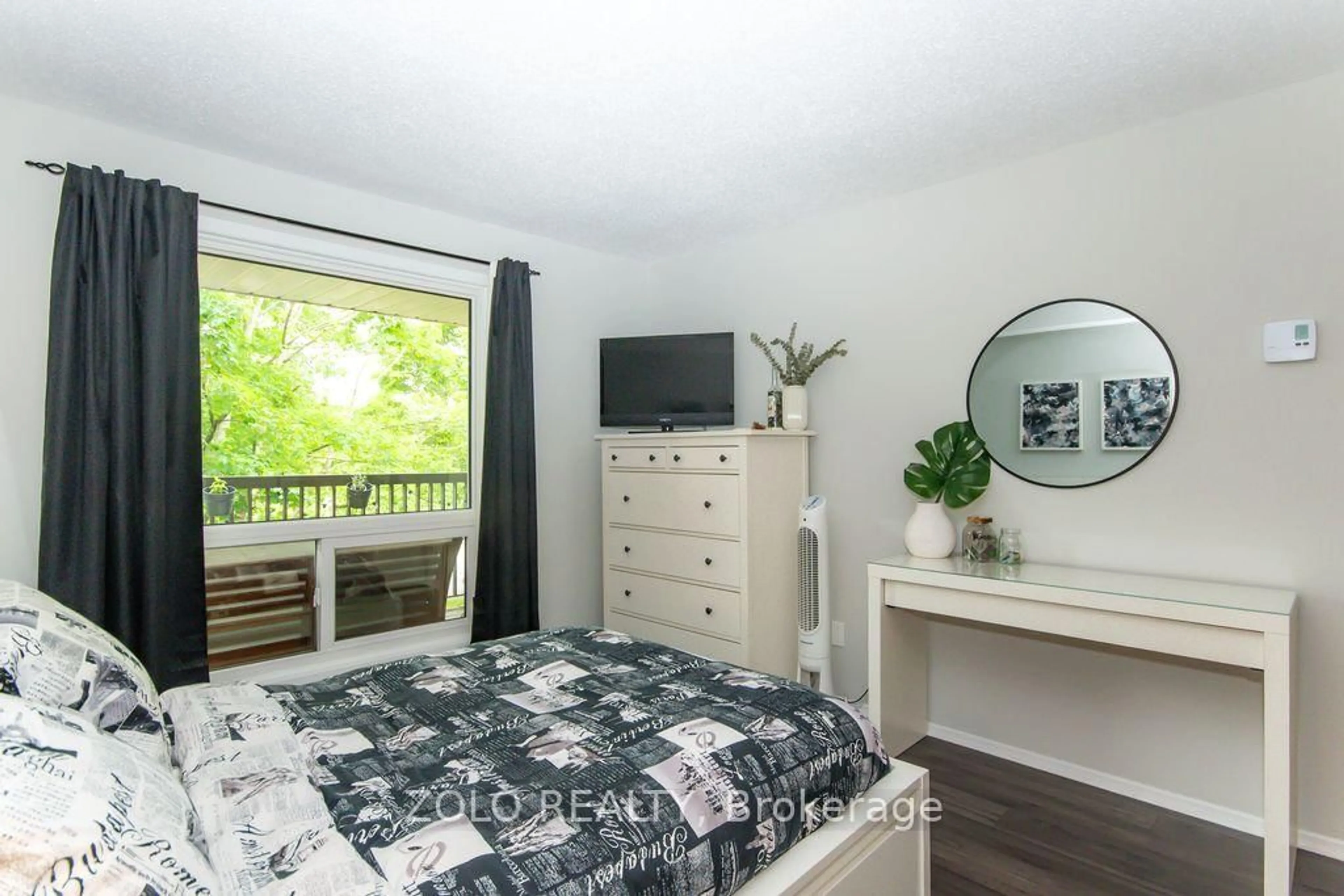 Bedroom with bed, wood/laminate floor for 6376 Bilberry Dr #206, Orleans Ontario K1C 4P8