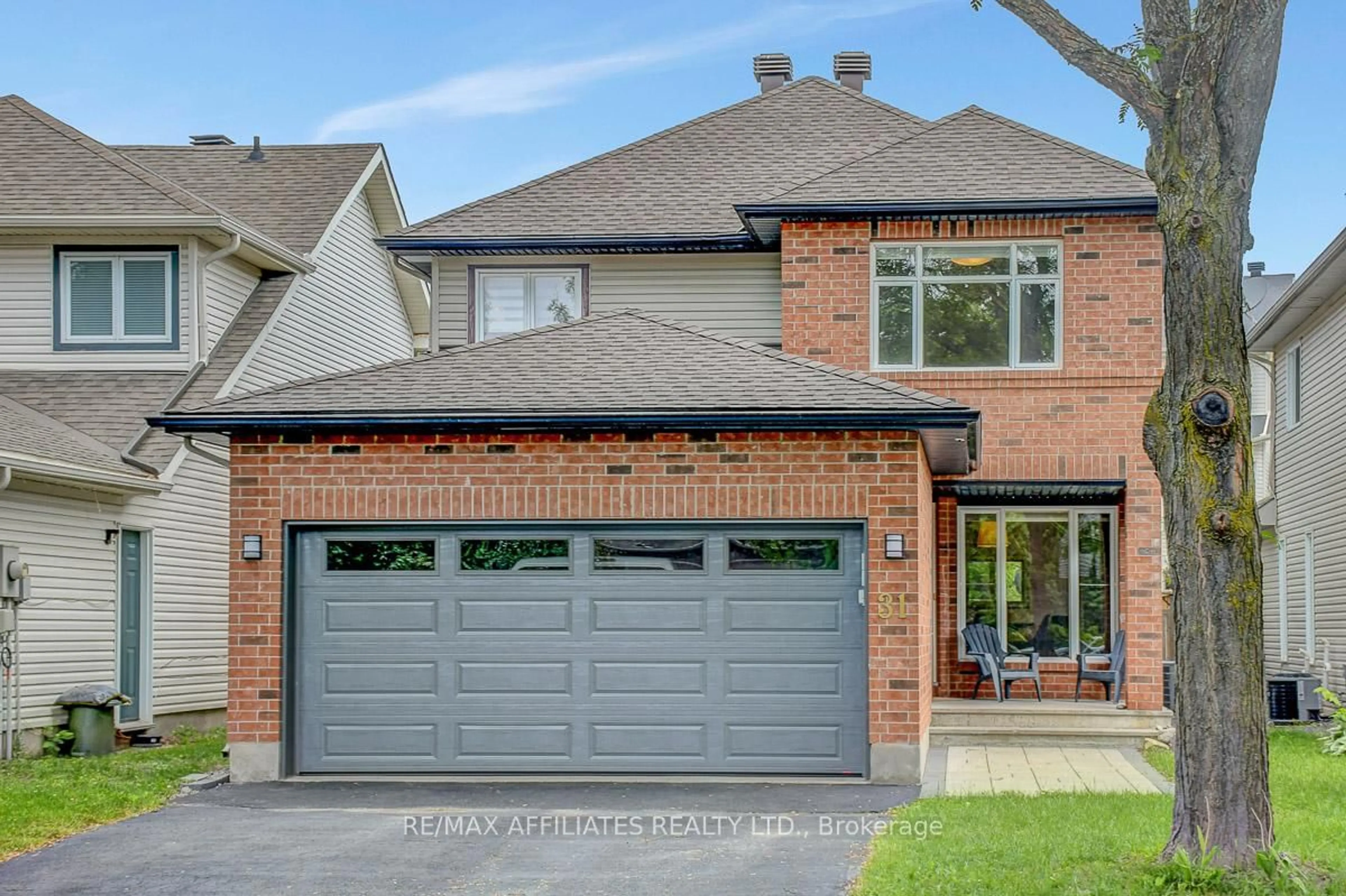 Home with brick exterior material, street for 31 Spur Ave, Ottawa Ontario K2M 2R9