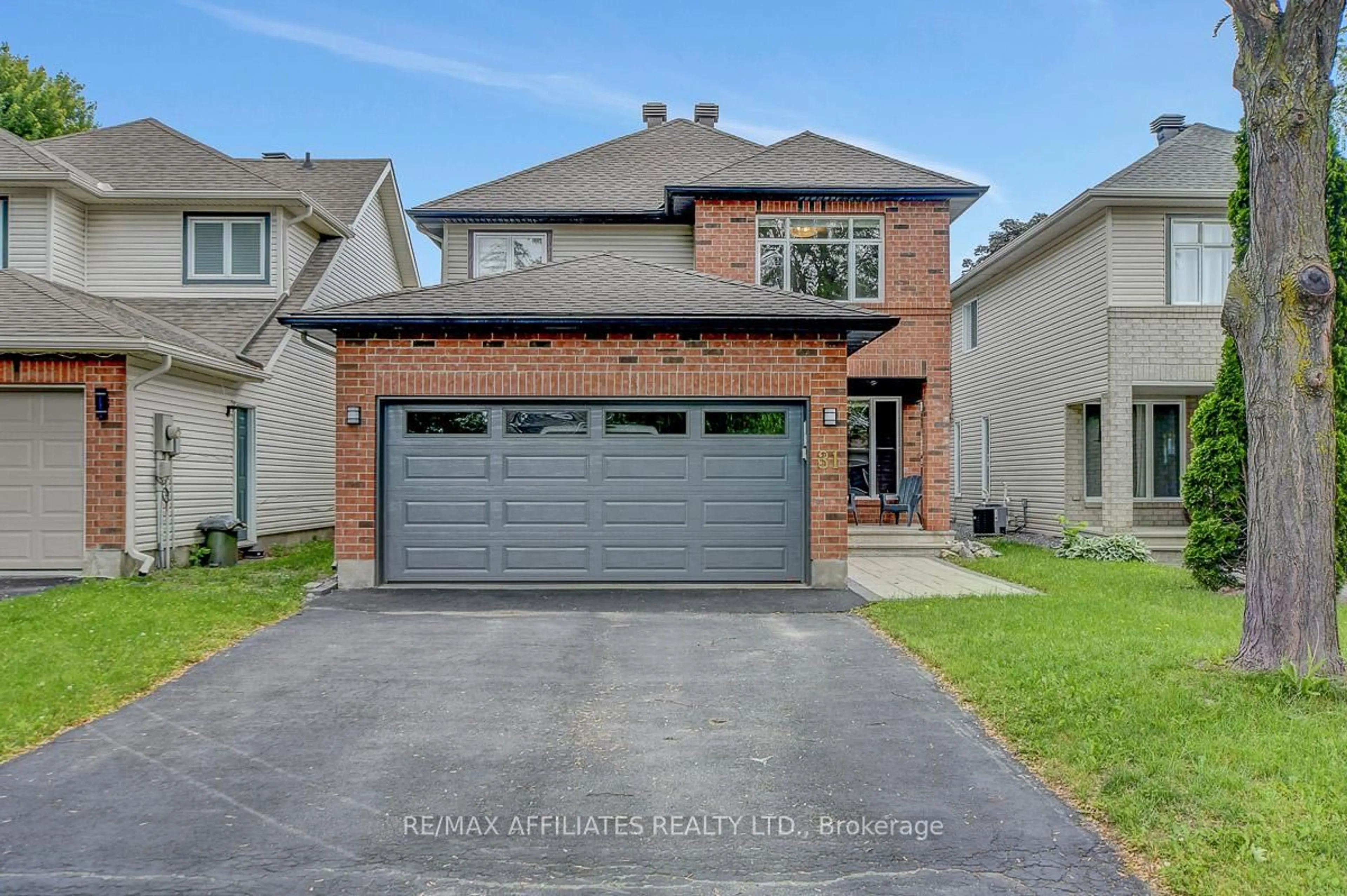 Home with brick exterior material, street for 31 Spur Ave, Ottawa Ontario K2M 2R9
