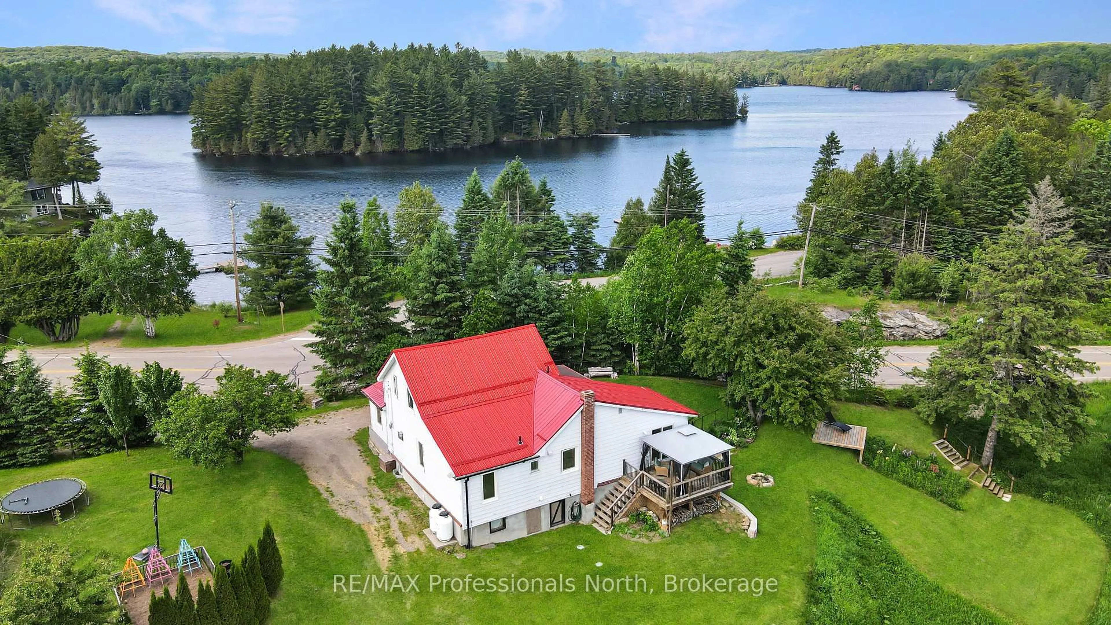 A pic from outside/outdoor area/front of a property/back of a property/a pic from drone, water/lake/river/ocean view for 10590 County 503 Rd, Highlands East Ontario K0M 1R0