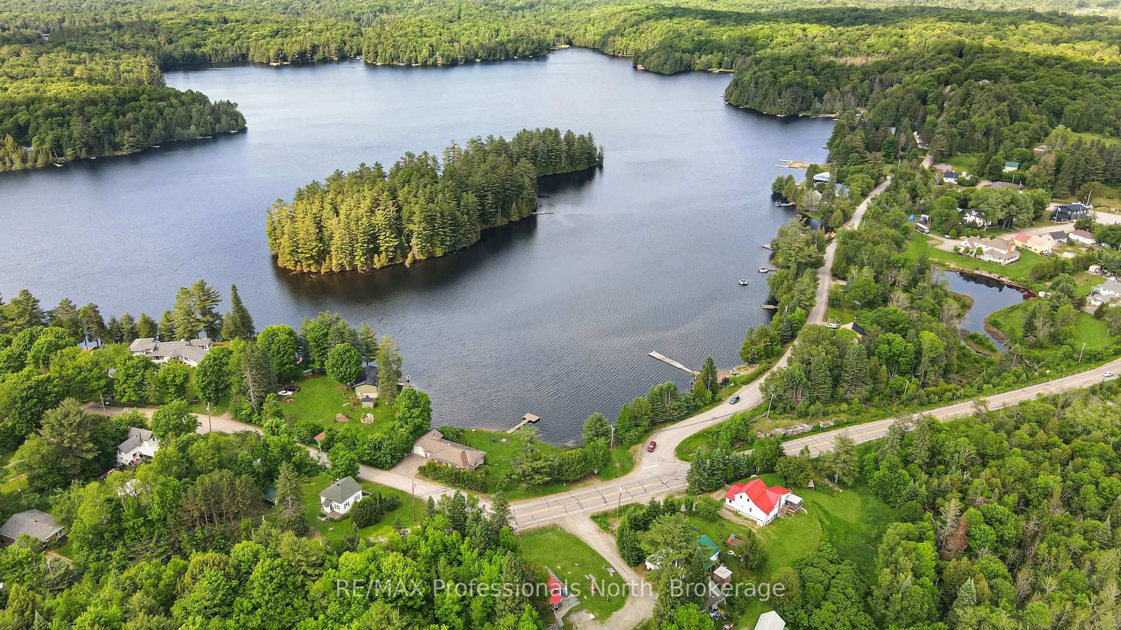A pic from outside/outdoor area/front of a property/back of a property/a pic from drone, water/lake/river/ocean view for 10590 County 503 Rd, Highlands East Ontario K0M 1R0
