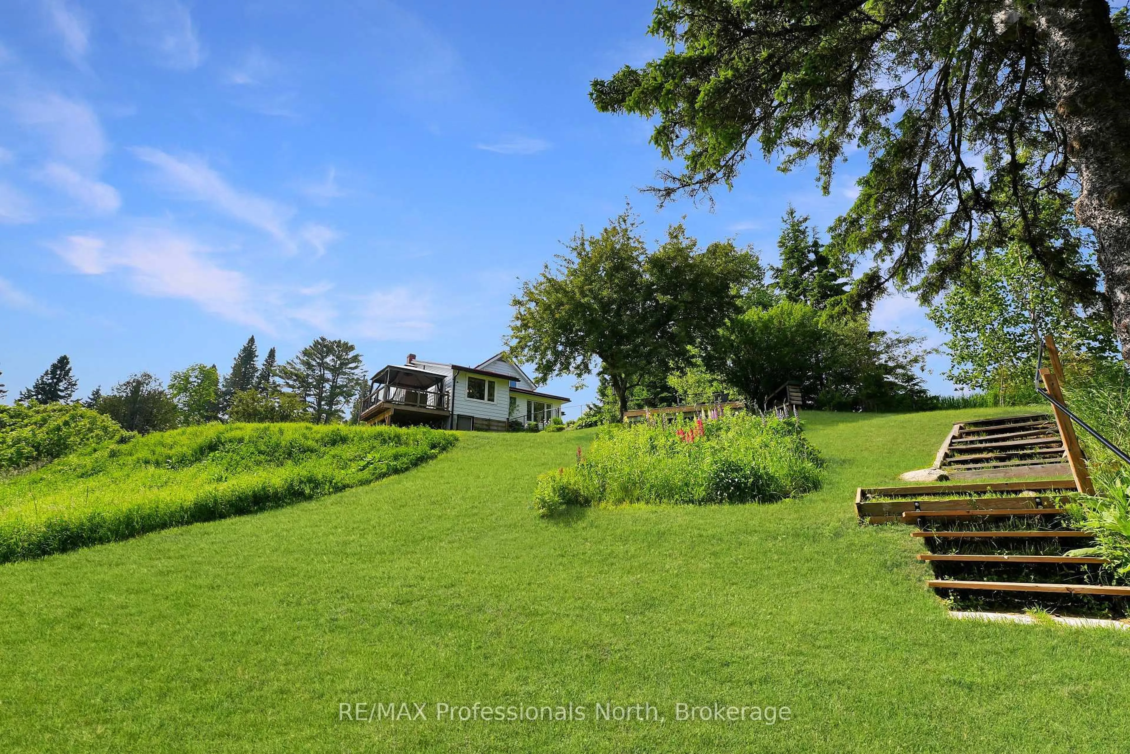 A pic from outside/outdoor area/front of a property/back of a property/a pic from drone, unknown for 10590 County 503 Rd, Highlands East Ontario K0M 1R0