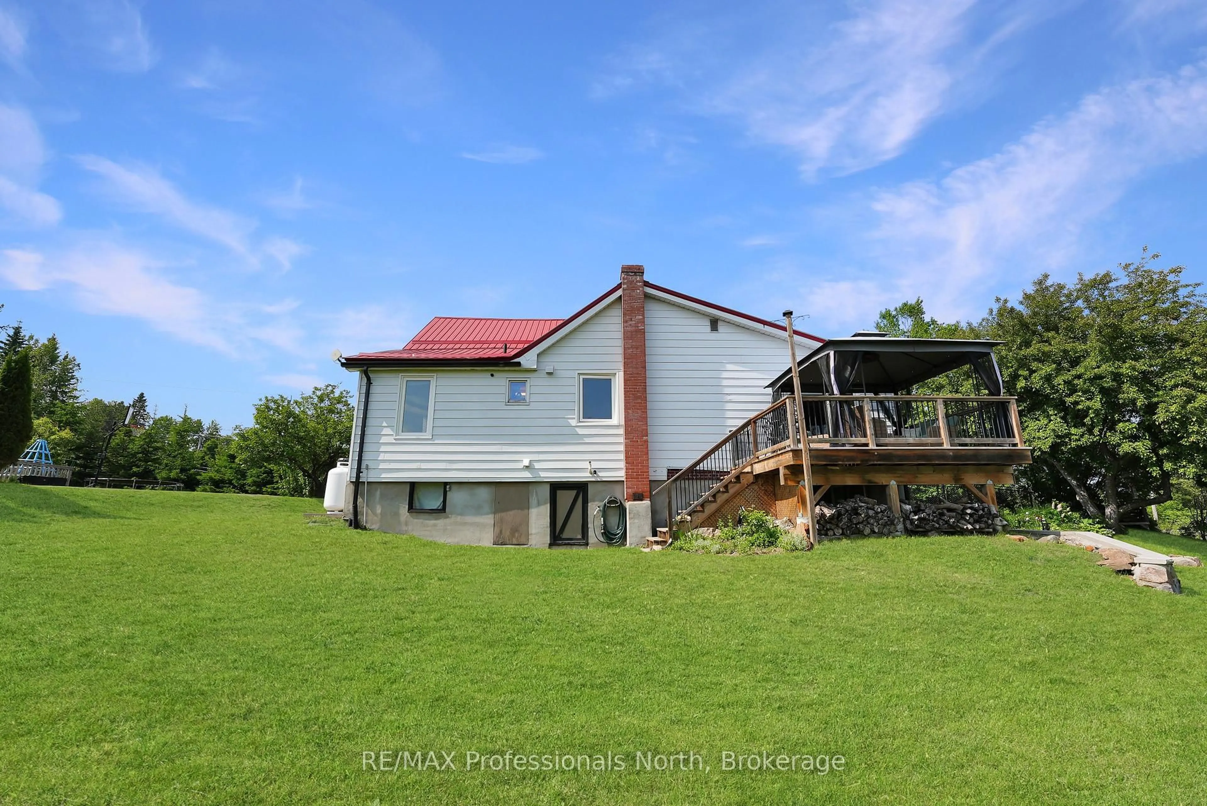A pic from outside/outdoor area/front of a property/back of a property/a pic from drone, unknown for 10590 County 503 Rd, Highlands East Ontario K0M 1R0