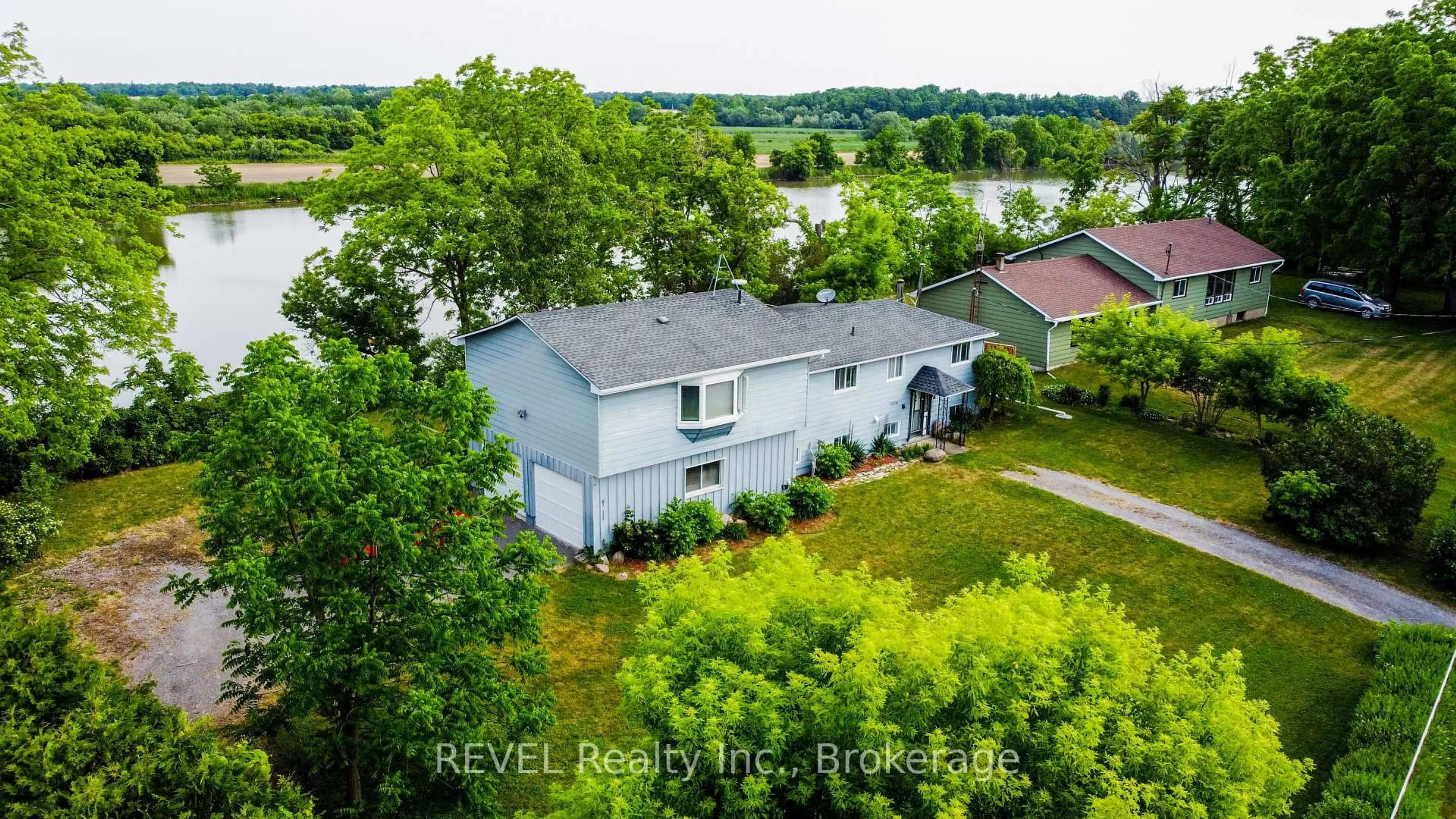 A pic from outside/outdoor area/front of a property/back of a property/a pic from drone, water/lake/river/ocean view for 1028 River Rd, Haldimand Ontario N0A 1E0