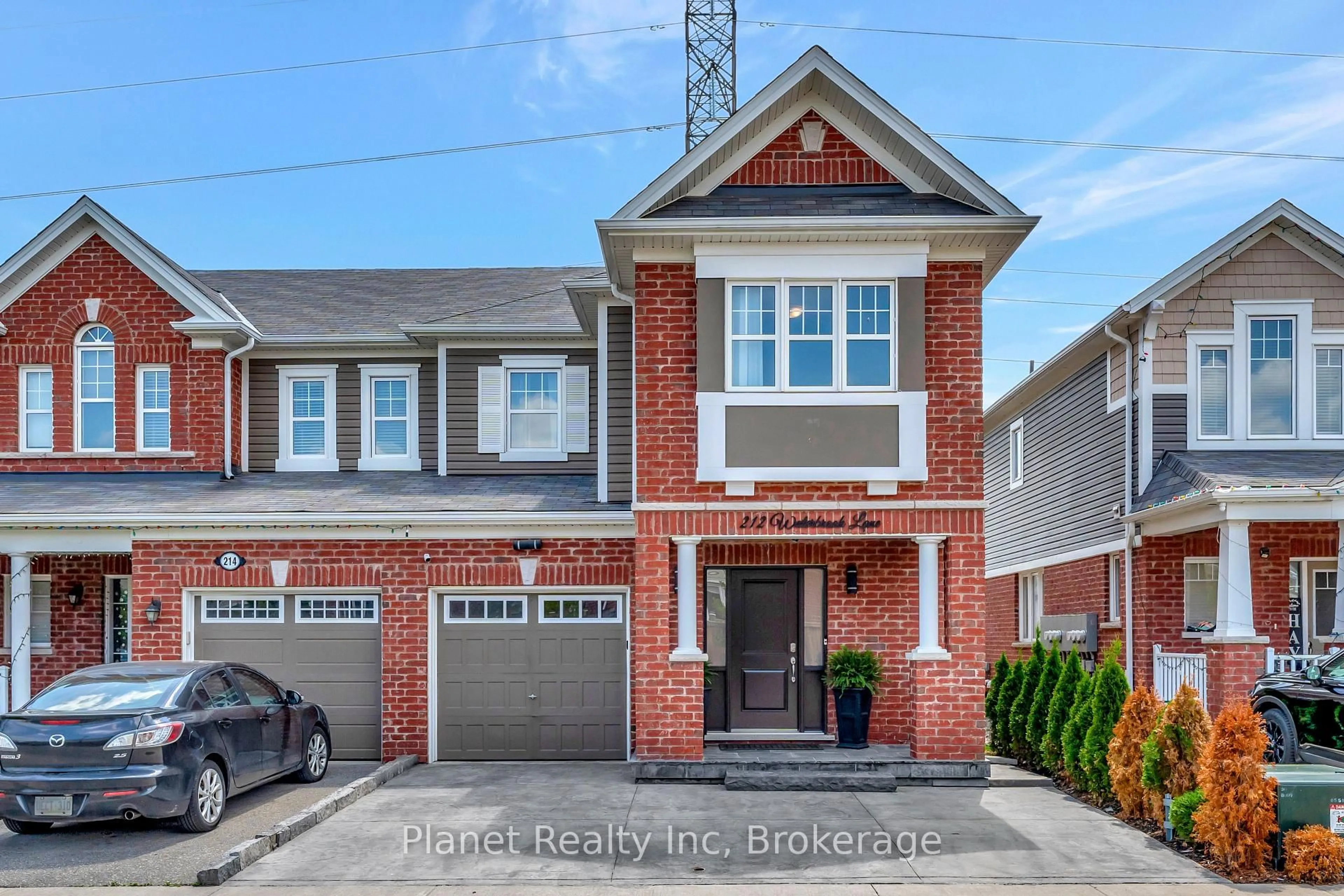 Home with brick exterior material, street for 212 Waterbrook Lane, Kitchener Ontario N2P 0H7