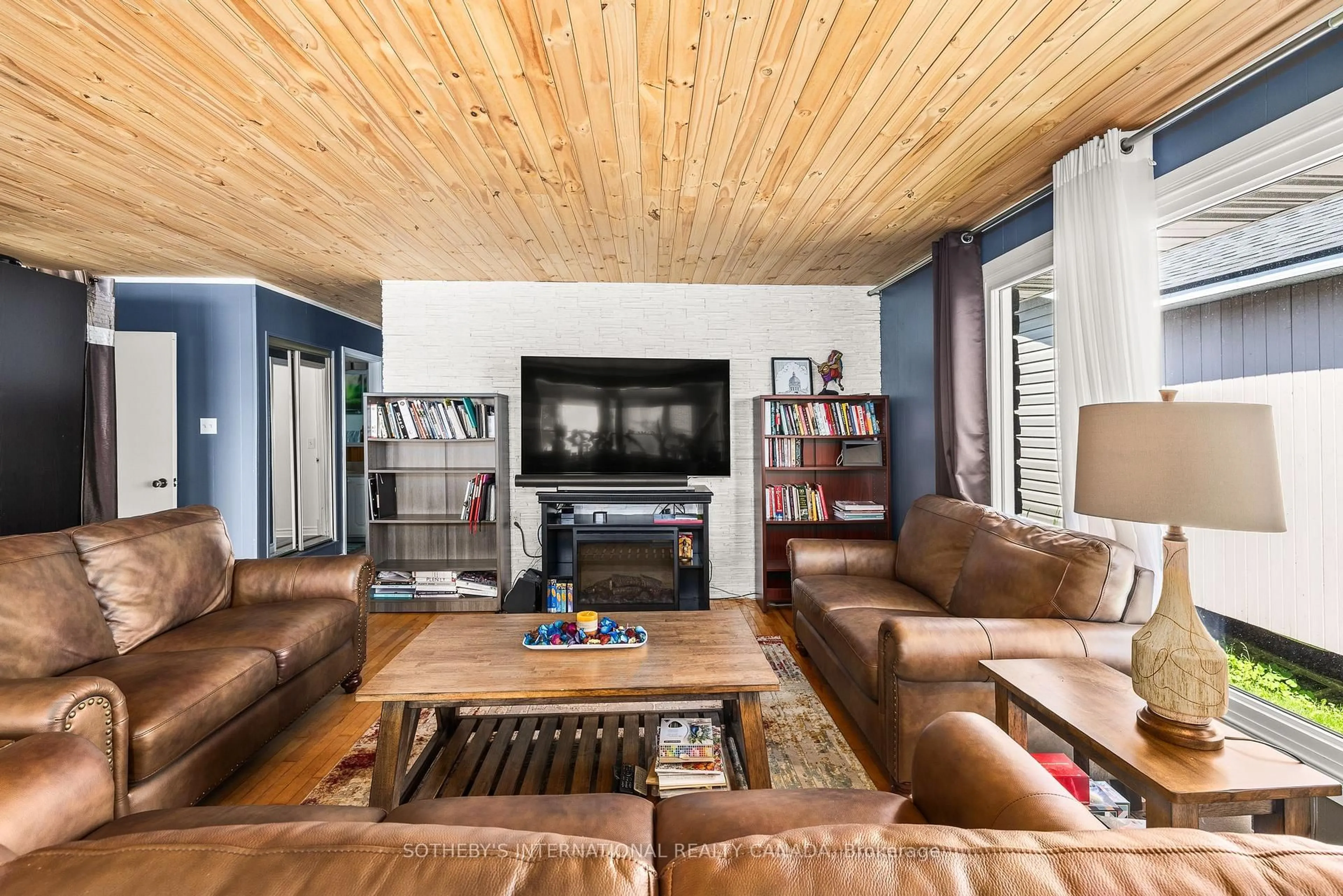 Living room with furniture, wood/laminate floor for 35 Sturtivans Lane, Leeds and the Thousand Islands Ontario K7G 2V4