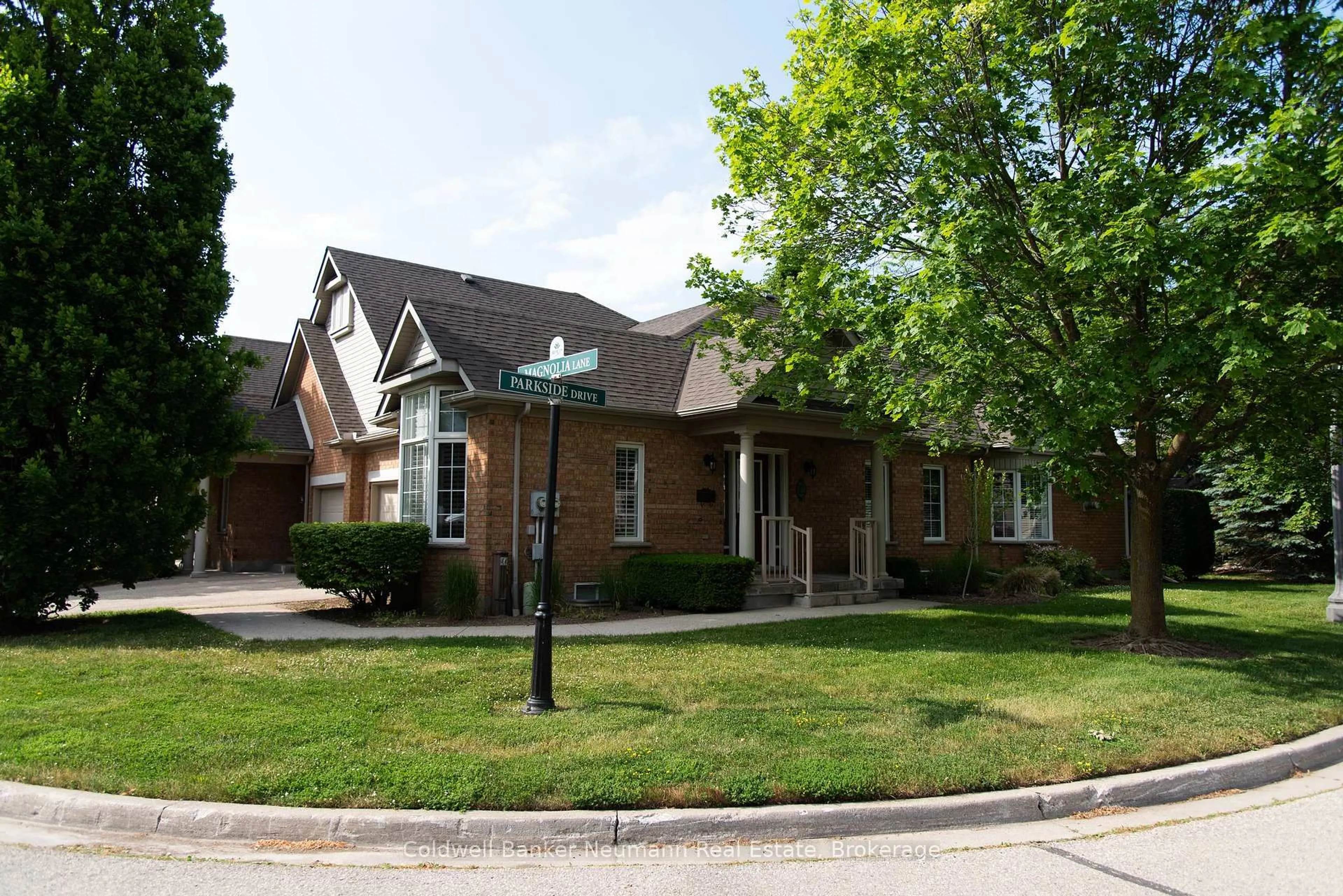 Home with brick exterior material, street for 22 Magnolia Lane, Guelph Ontario N1G 4X7