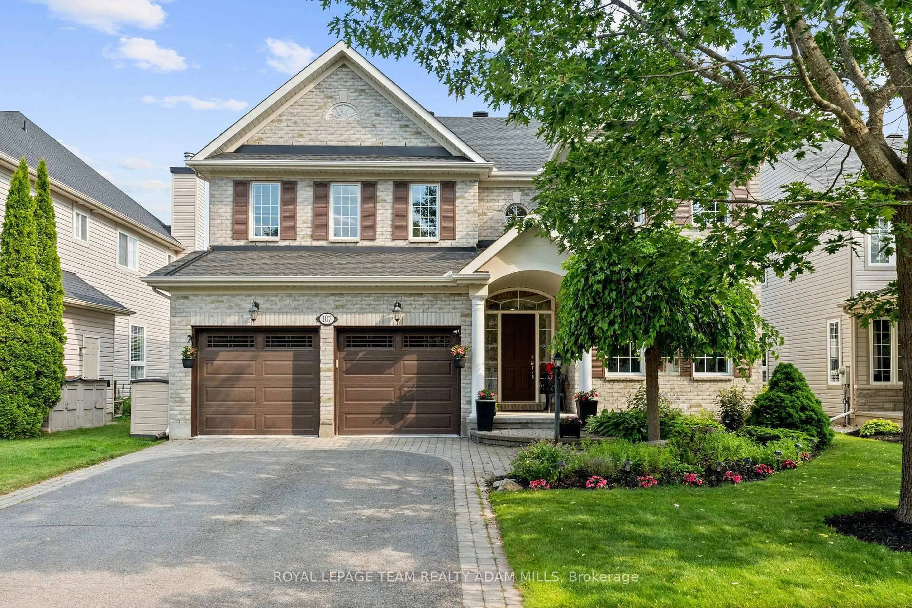 Home with brick exterior material, street for 107 Riverstone Dr, Ottawa Ontario K2J 5E3