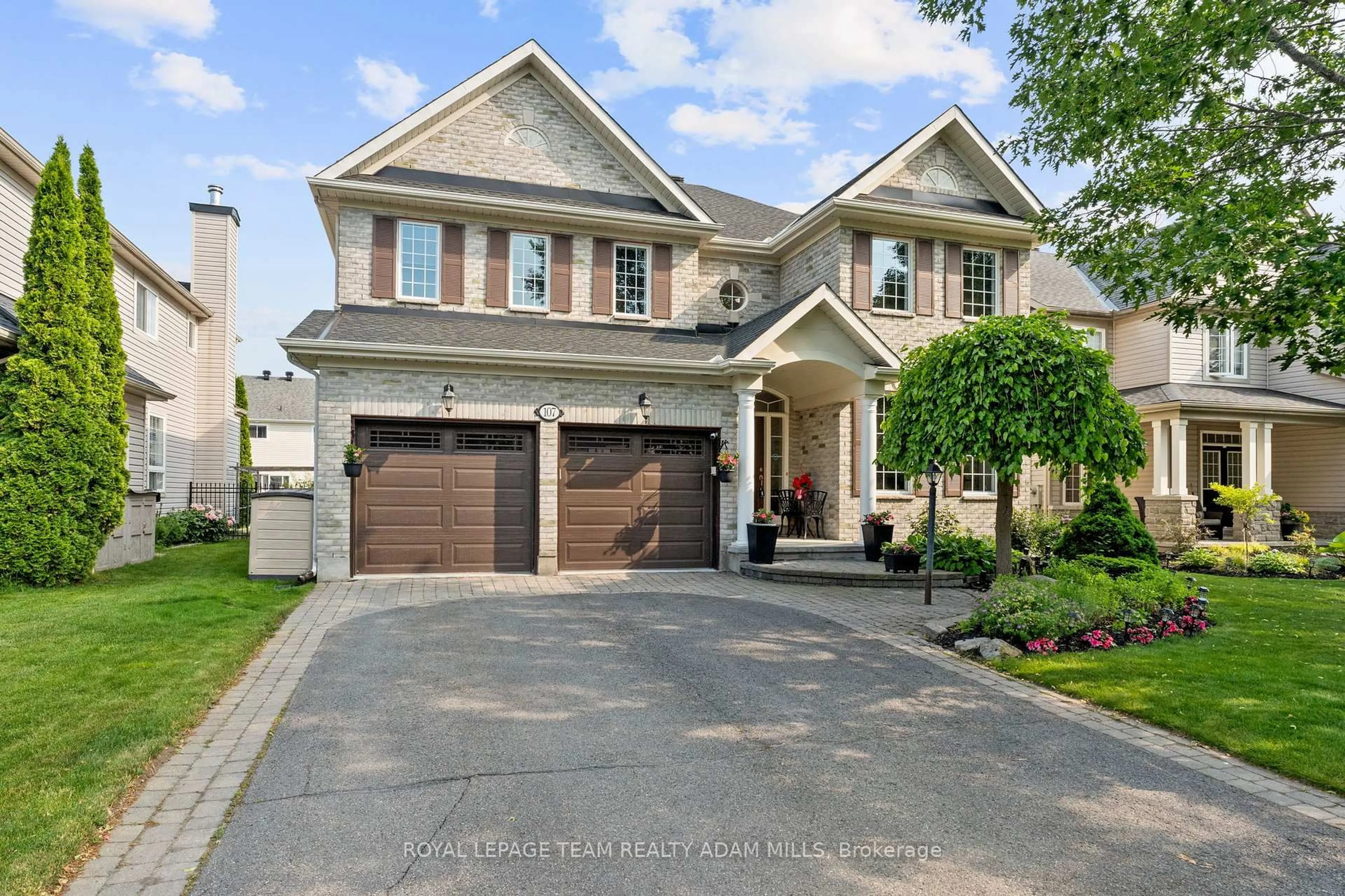 Home with brick exterior material, street for 107 Riverstone Dr, Ottawa Ontario K2J 5E3