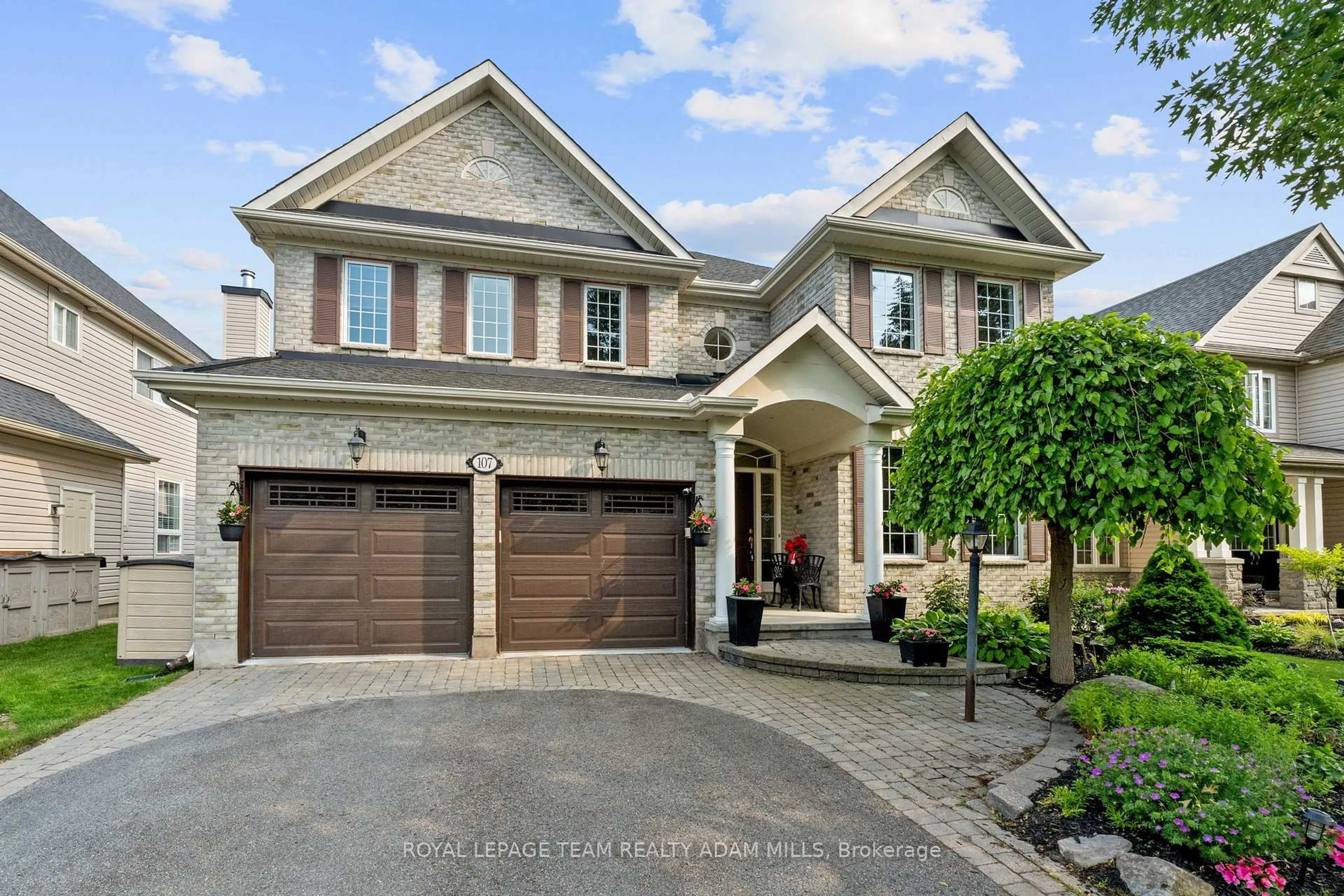 Home with brick exterior material, street for 107 Riverstone Dr, Ottawa Ontario K2J 5E3
