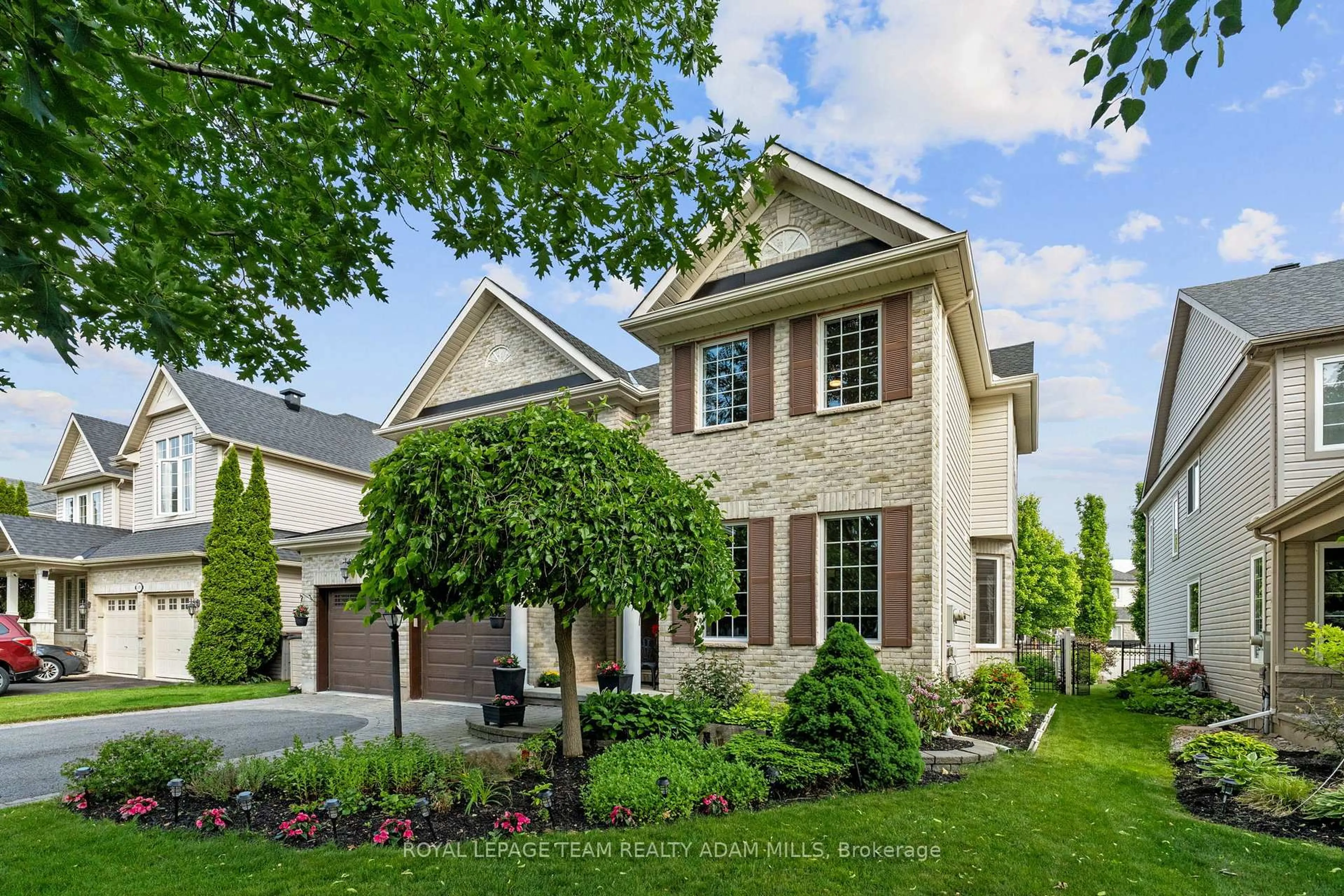 Home with brick exterior material, street for 107 Riverstone Dr, Ottawa Ontario K2J 5E3
