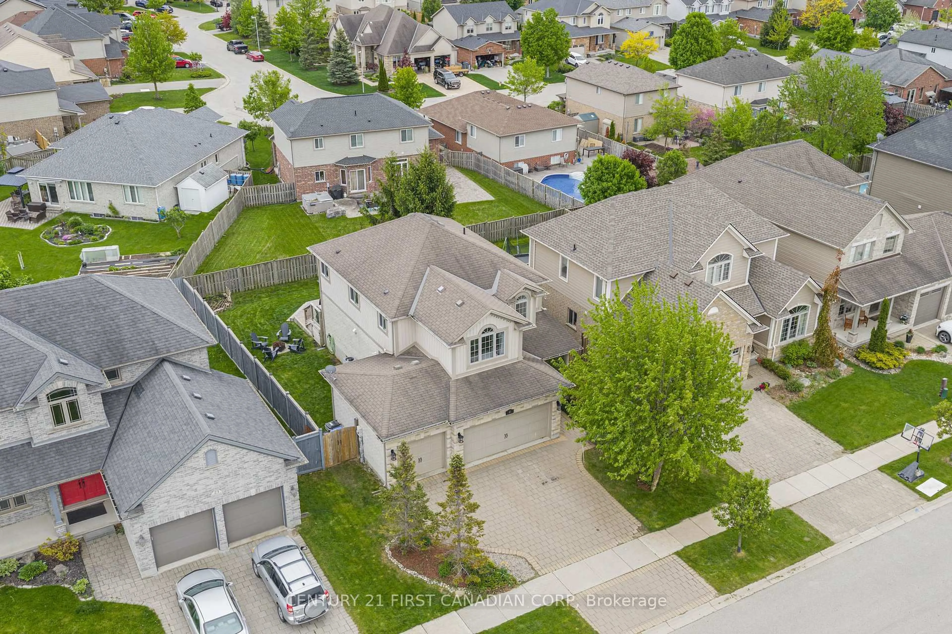 A pic from outside/outdoor area/front of a property/back of a property/a pic from drone, street for 21 Maplewood Lane, Middlesex Centre Ontario M0M 2A0