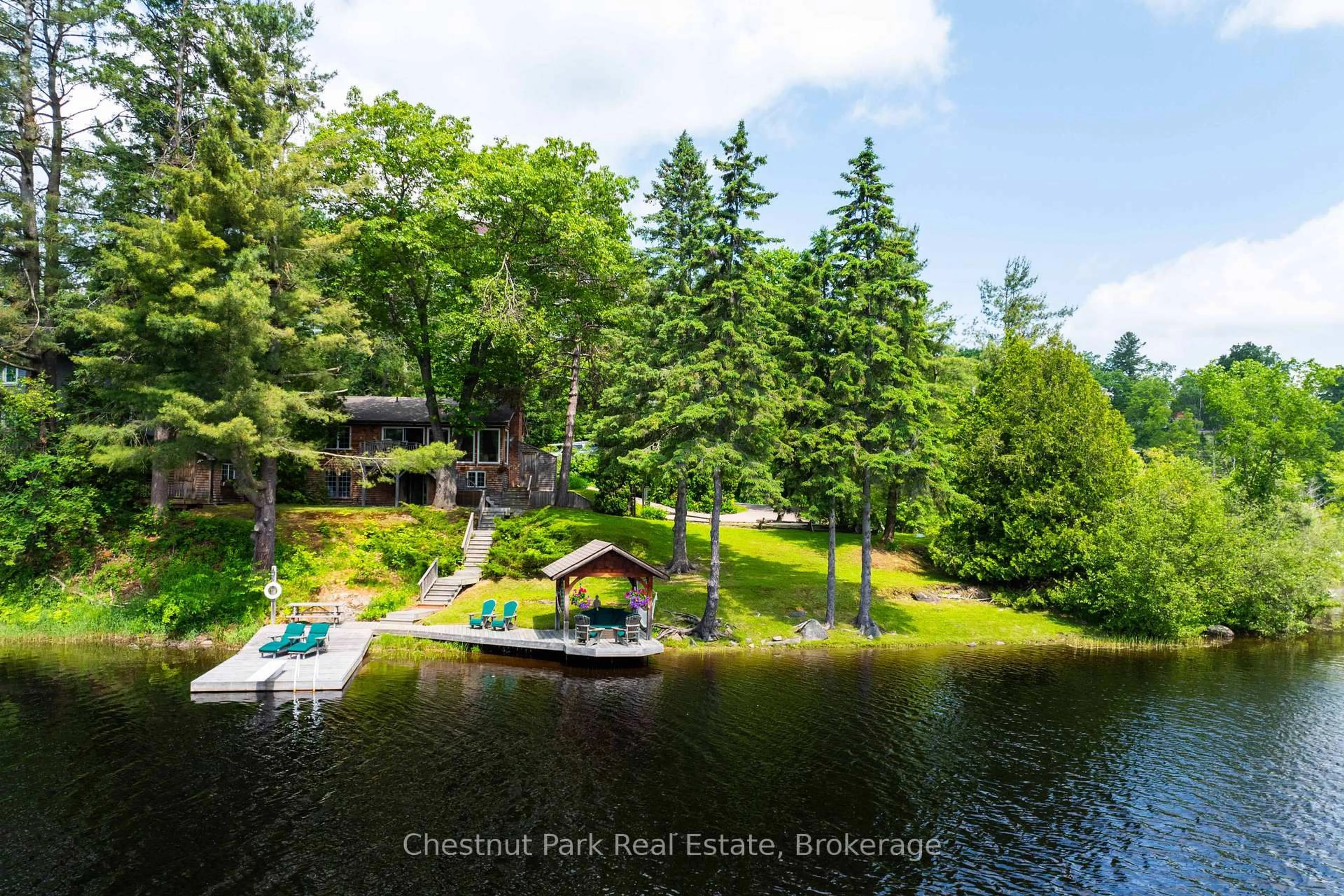 A pic from outside/outdoor area/front of a property/back of a property/a pic from drone, water/lake/river/ocean view for 78 Dill St, Bracebridge Ontario P1L 1E5