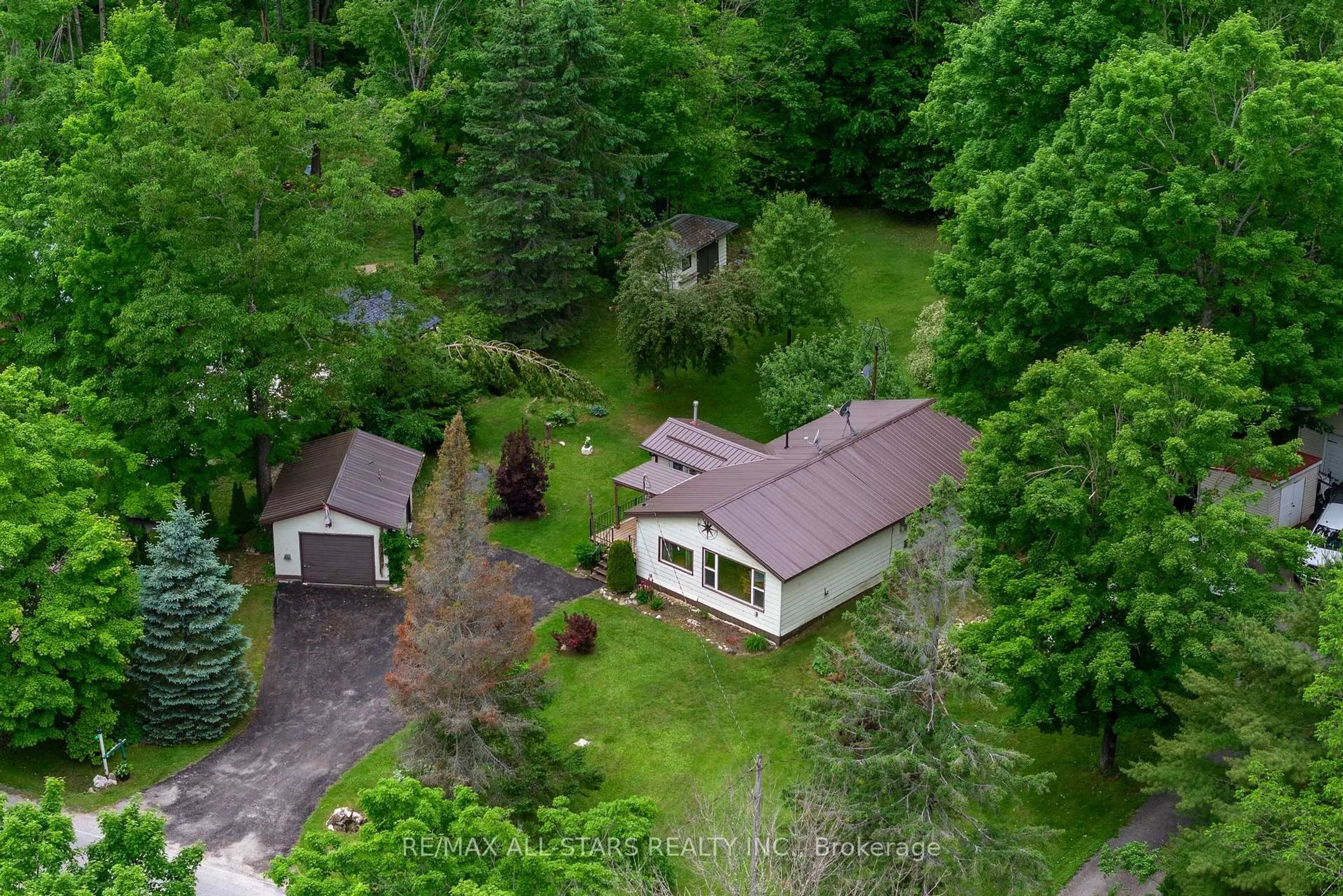 A pic from outside/outdoor area/front of a property/back of a property/a pic from drone, forest/trees view for 93 Northern Ave, Trent Lakes Ontario K0M 1A0
