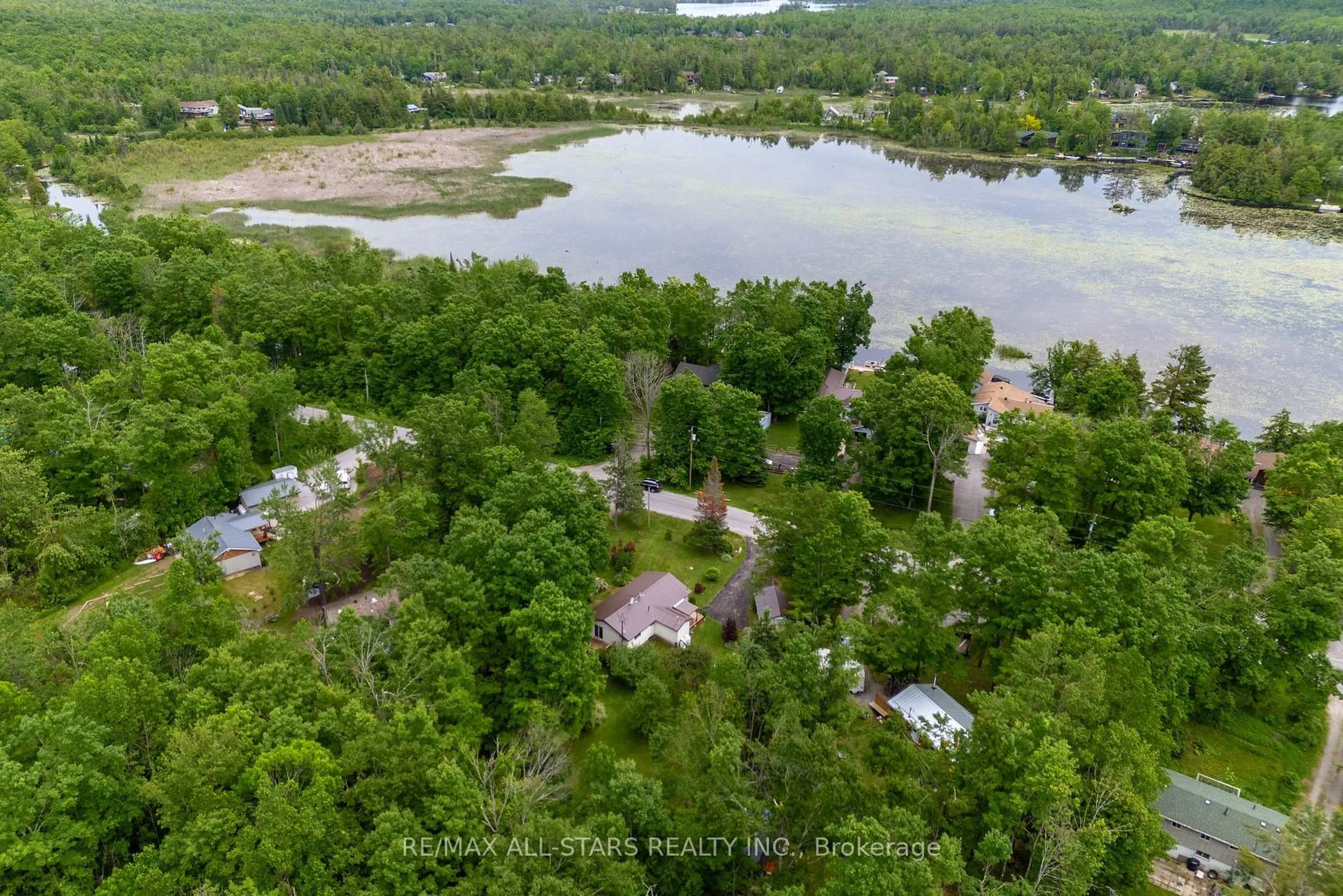 A pic from outside/outdoor area/front of a property/back of a property/a pic from drone, water/lake/river/ocean view for 93 Northern Ave, Trent Lakes Ontario K0M 1A0