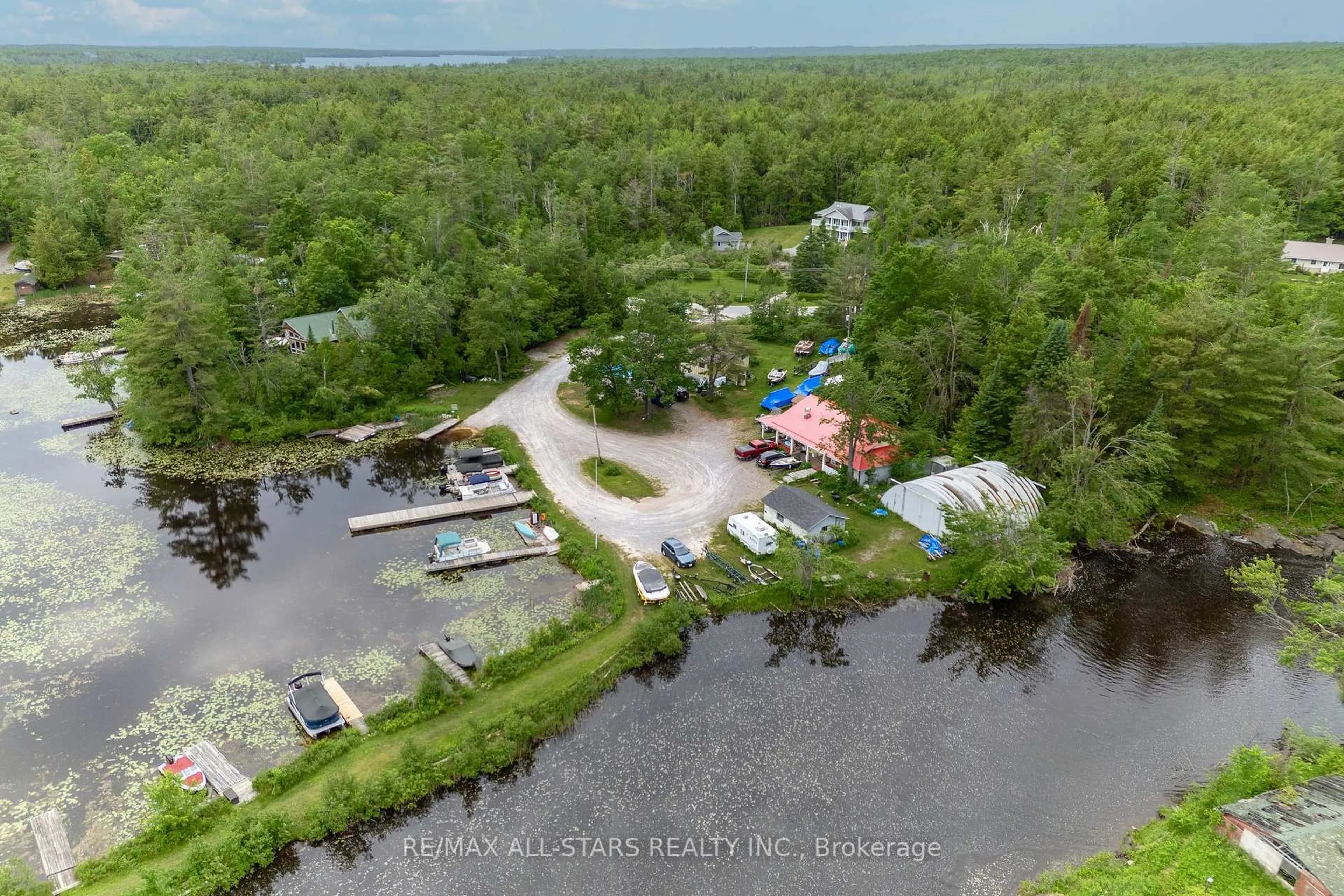 A pic from outside/outdoor area/front of a property/back of a property/a pic from drone, water/lake/river/ocean view for 93 Northern Ave, Trent Lakes Ontario K0M 1A0
