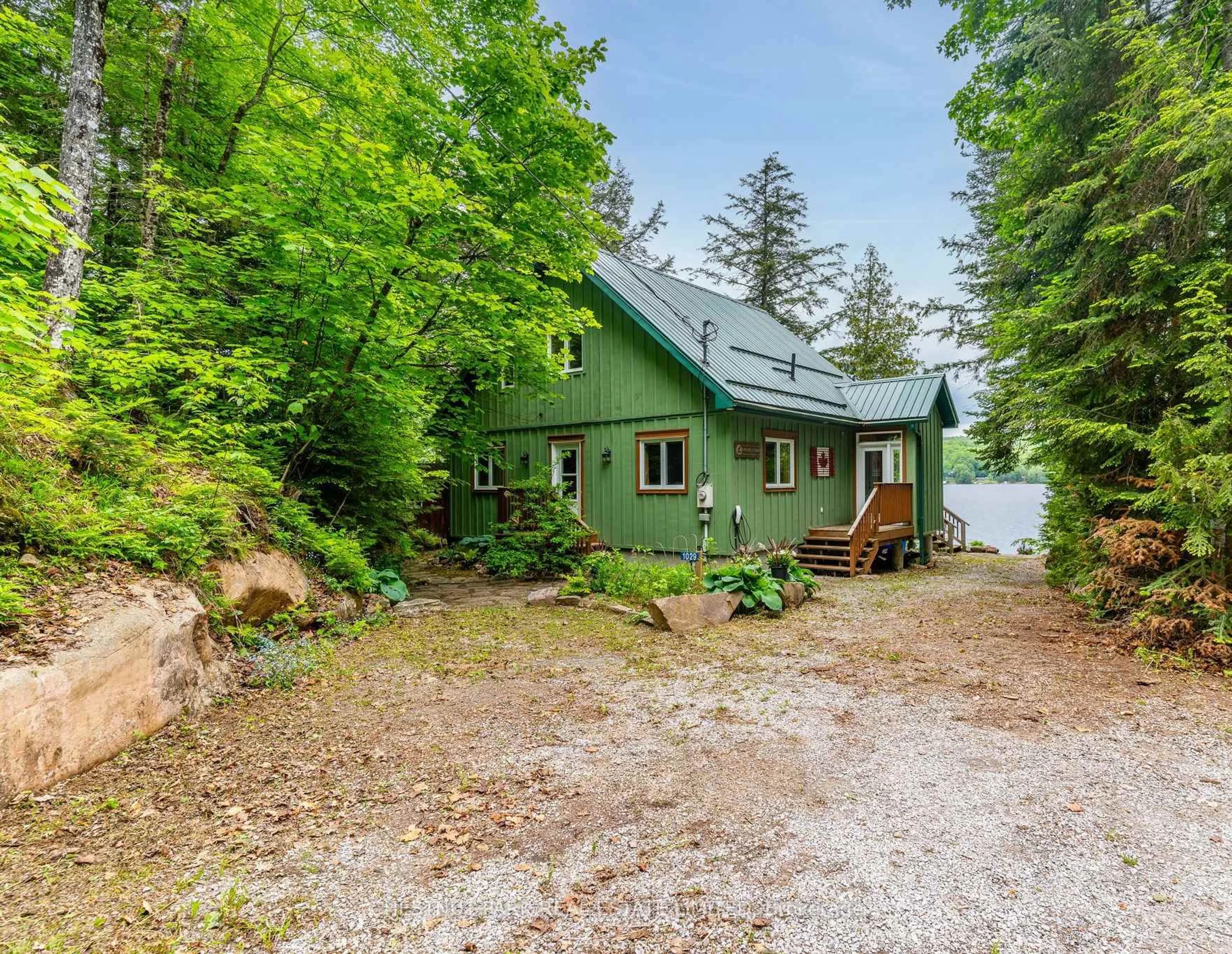 A pic from outside/outdoor area/front of a property/back of a property/a pic from drone, water/lake/river/ocean view for 1029 Badger Lane, Dysart et al Ontario K0M 1S0