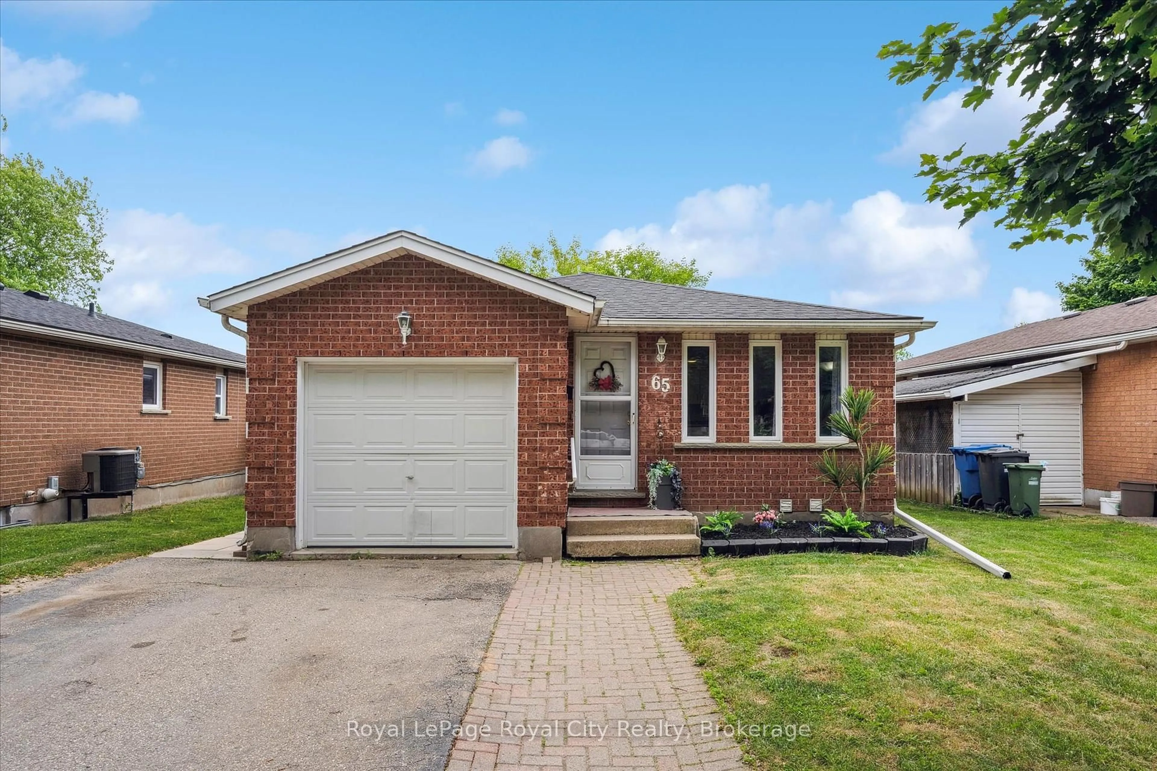 Home with brick exterior material, street for 65 Eastview Rd, Guelph Ontario N1E 6K5