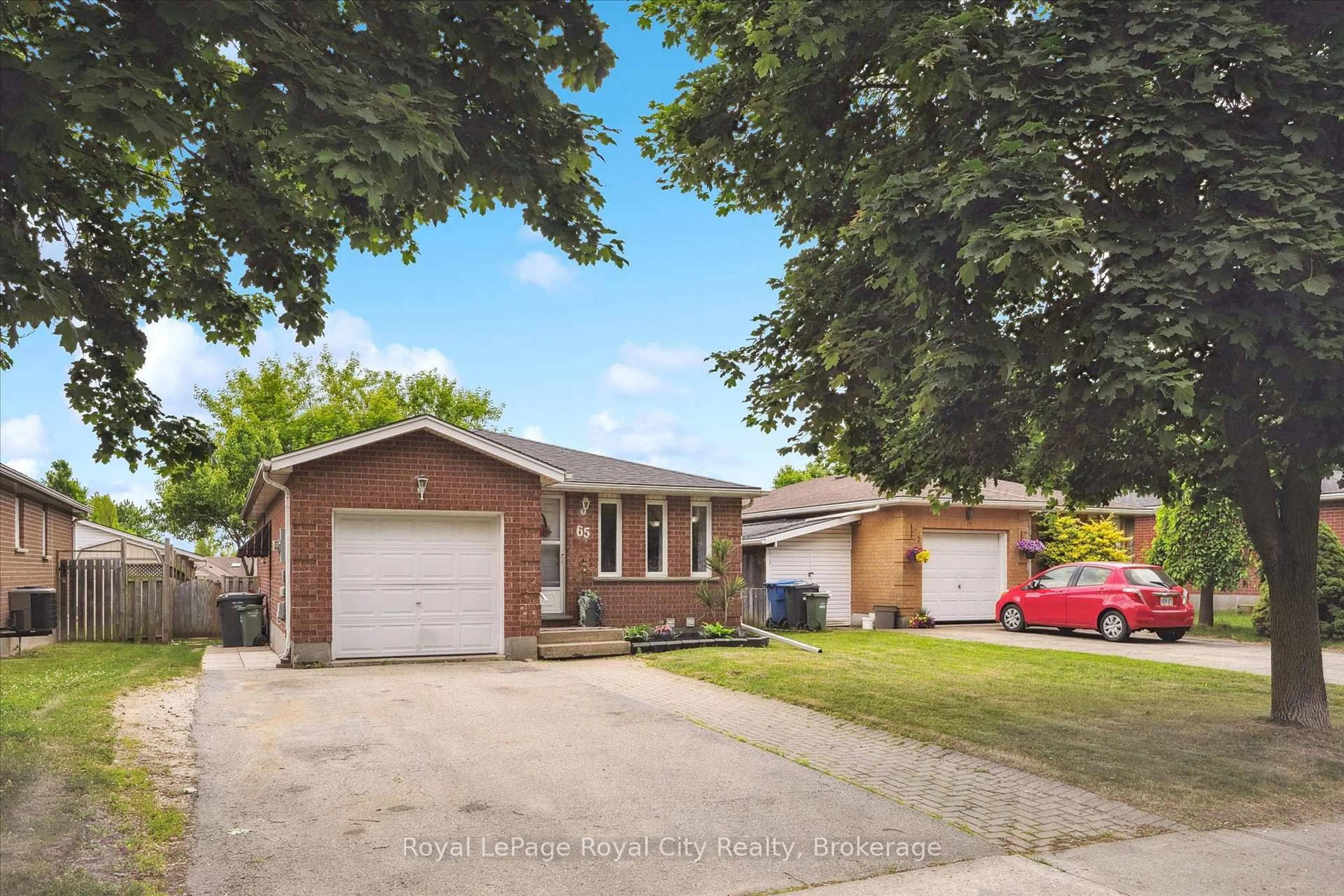 Home with brick exterior material, street for 65 Eastview Rd, Guelph Ontario N1E 6K5