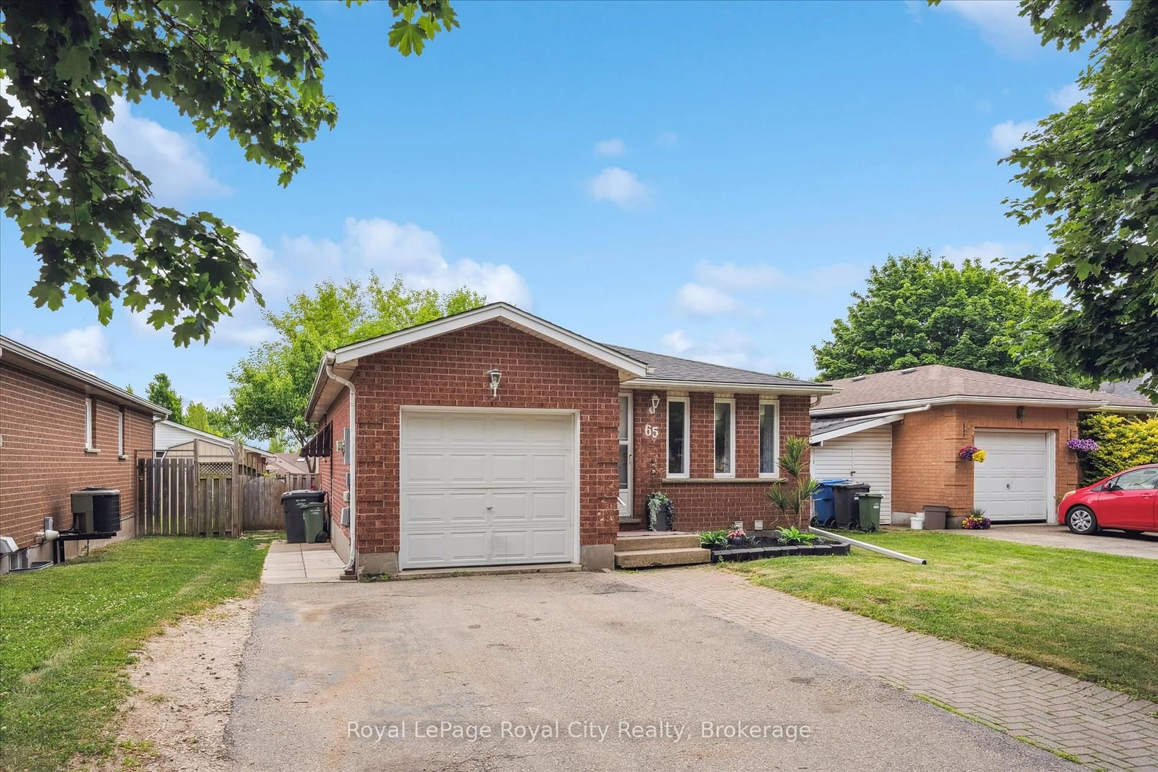 Home with brick exterior material, street for 65 Eastview Rd, Guelph Ontario N1E 6K5